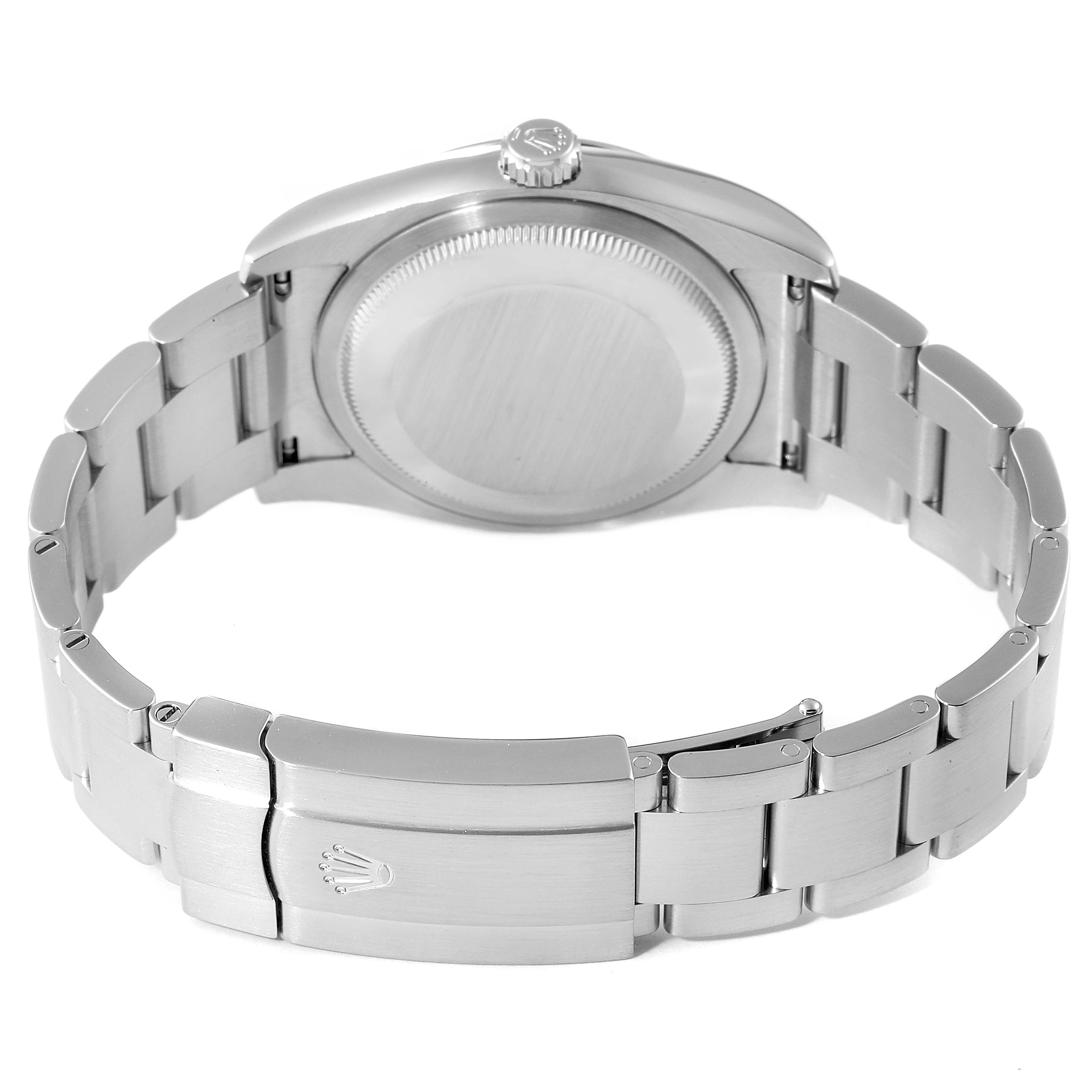 The image shows a rear view of the Rolex Oyster Perpetual 116000 Men's Stainless Steel Champagne Dial 116000 Men's Stainless Steel Champagne Dial watch, highlighting the bracelet and clasp.