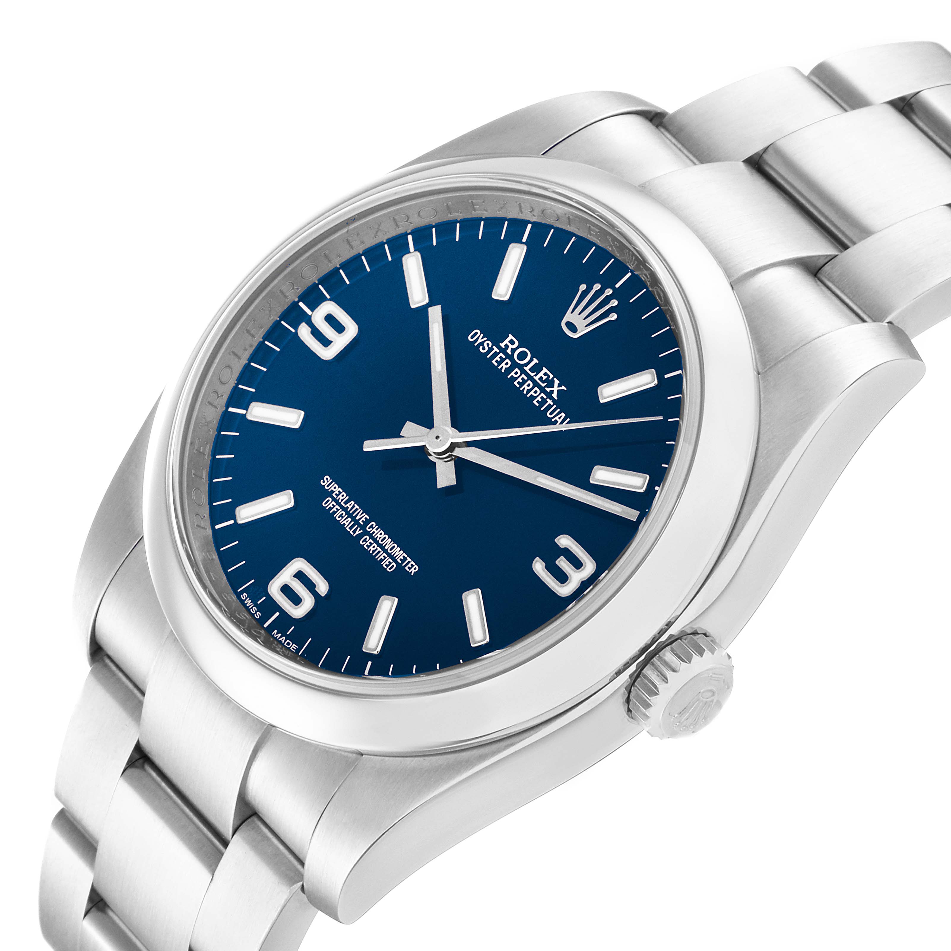The image shows a Rolex Oyster Perpetual 116000 Men's Stainless Steel Blue Dial 116000 Men's Stainless Steel Blue Dial watch at an angled side view, highlighting the dial, crown, and bracelet.