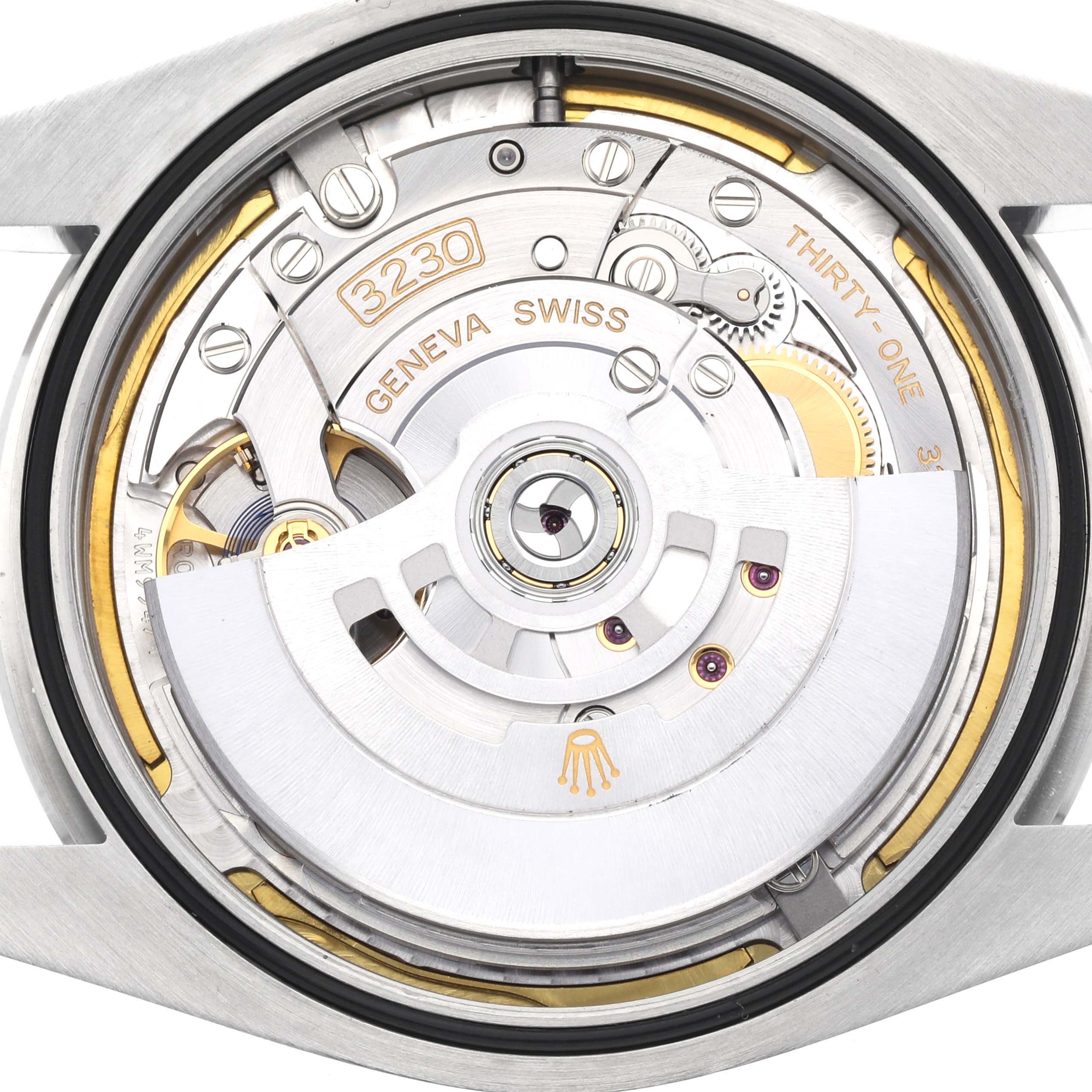 This image shows the inner mechanics of the Rolex Oyster Perpetual 124300 Men's Stainless Steel Yellow Dial 124300 Men's Stainless Steel Yellow Dial watch, highlighting its movement components.