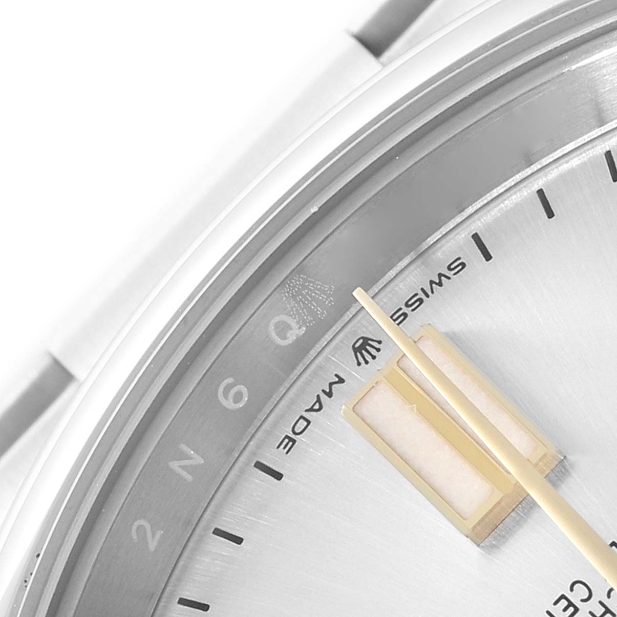 The image shows a close-up of a Rolex Oyster Perpetual 124300 Men's Stainless Steel Silver Dial 124300 Men's Stainless Steel Silver Dial watch dial, highlighting the "Swiss Made" text and minute indices.