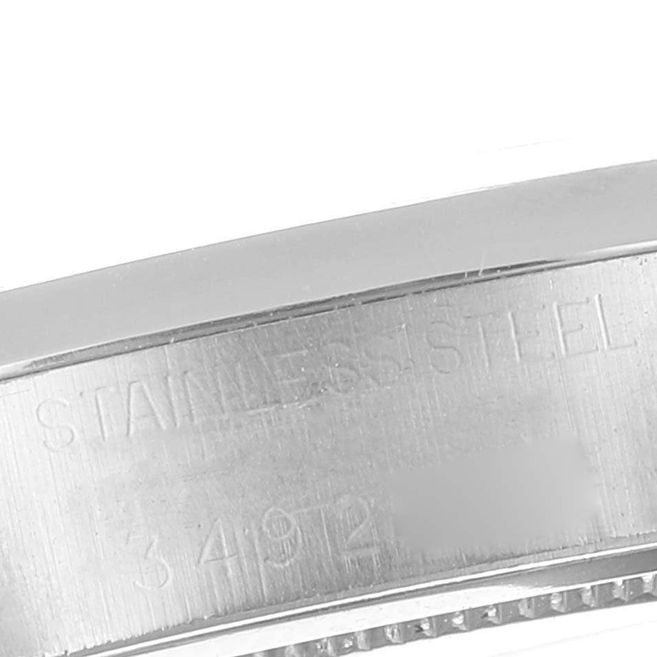 This close-up image shows a polished section of the stainless steel casing of the Rolex Vintage Collection 6694 Men's Stainless Steel Black Dial 6694 Men's Stainless Steel Black Dial model.