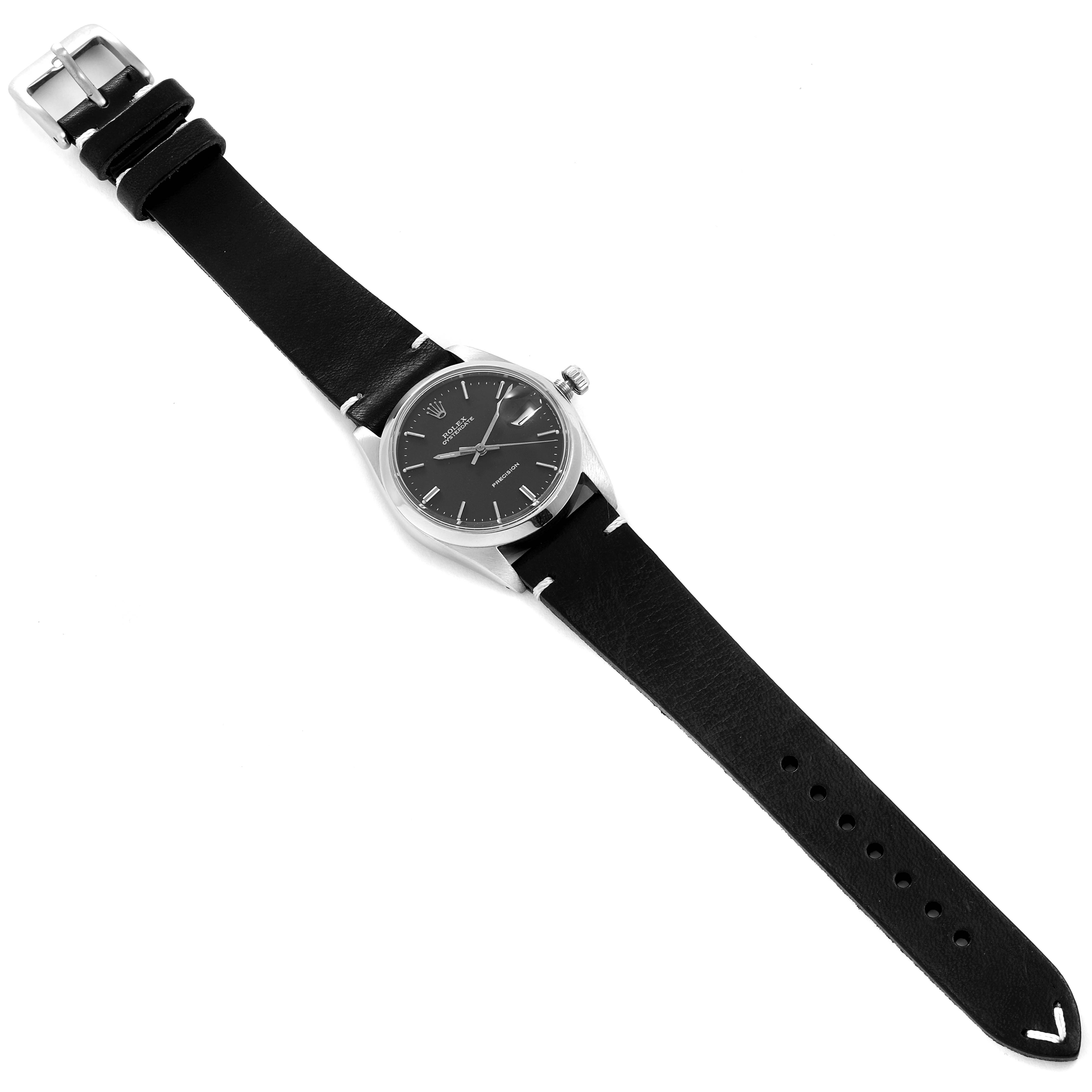 The Rolex Vintage Collection 6694 Men's Stainless Steel Black Dial 6694 Men's Stainless Steel Black Dial watch is shown from a top-down angle, displaying the face, case, and full leather strap.