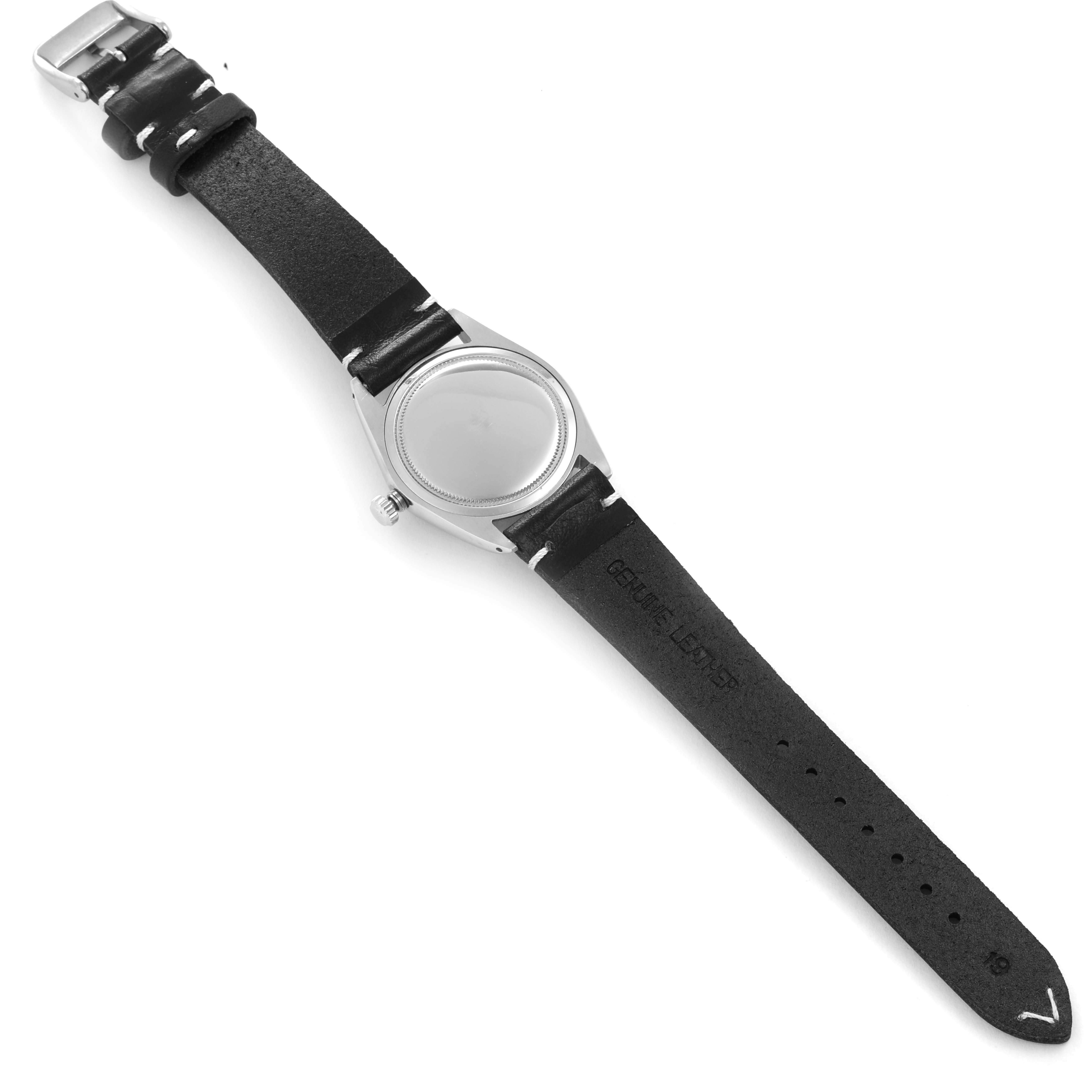 The image shows a Rolex Vintage Collection 6694 Men's Stainless Steel Black Dial 6694 Men's Stainless Steel Black Dial watch laid flat, focusing on its face, case, and black leather strap.