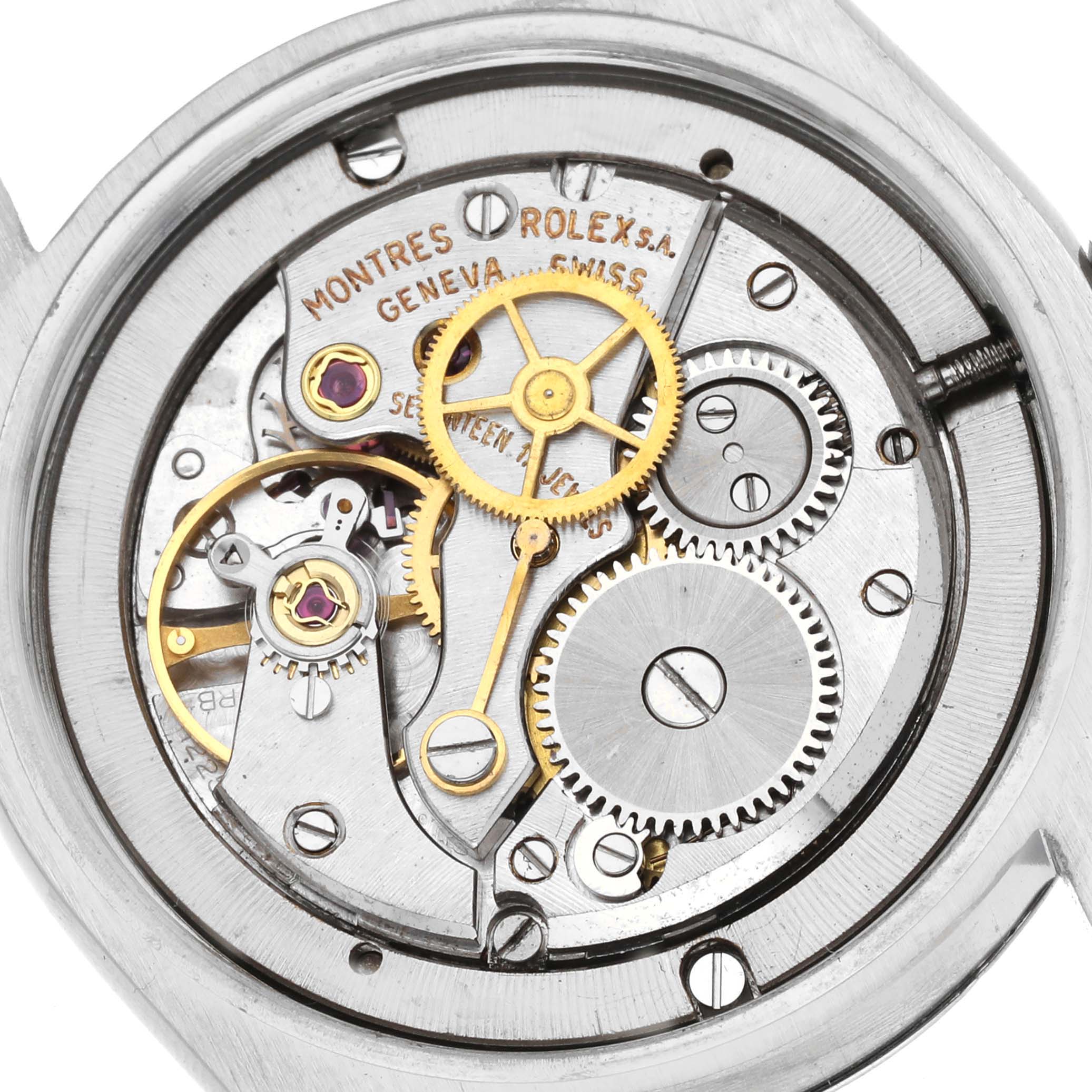 The image shows the internal movement of a Rolex Vintage Collection 6694 Men's Stainless Steel Champagne Dial 6694 Men's Stainless Steel Champagne Dial watch, including gears and mechanical components, from the back angle.