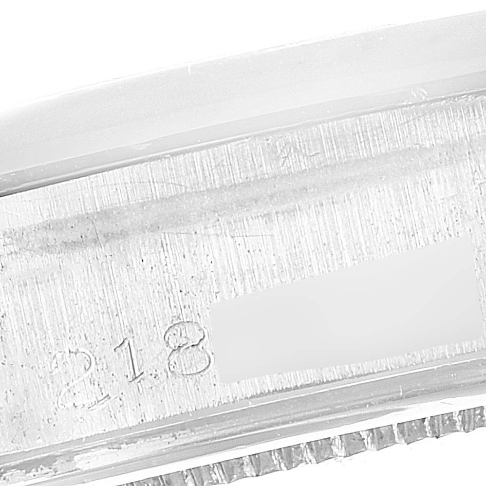 The image shows a close-up of the serial number engraved on the inner case of the Vintage Collection model by Rolex.