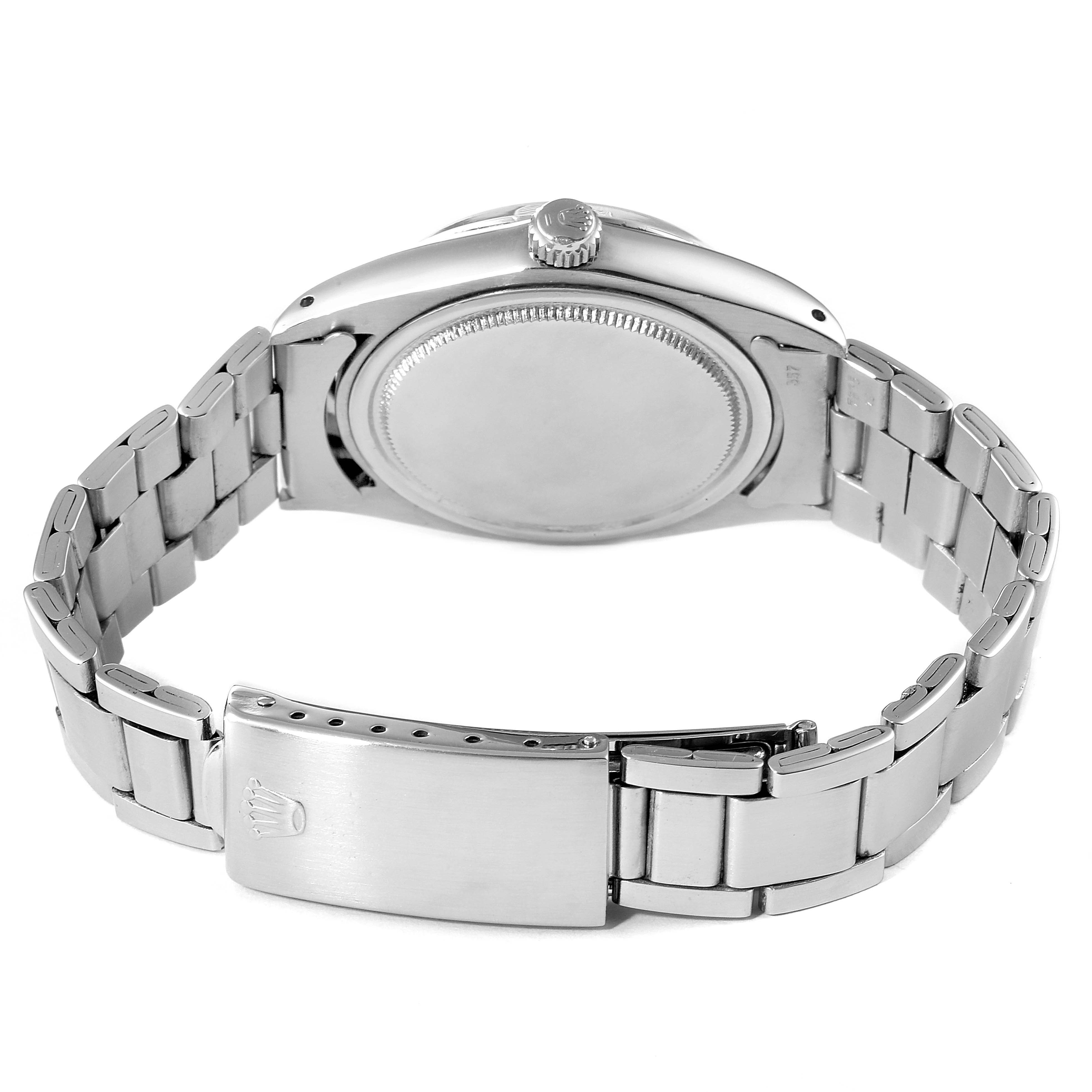 The image shows the back angle of the Rolex Vintage Collection 6694 Men's Stainless Steel Silver Dial 6694 Men's Stainless Steel Silver Dial watch, highlighting the case back, crown, and bracelet with clasp.