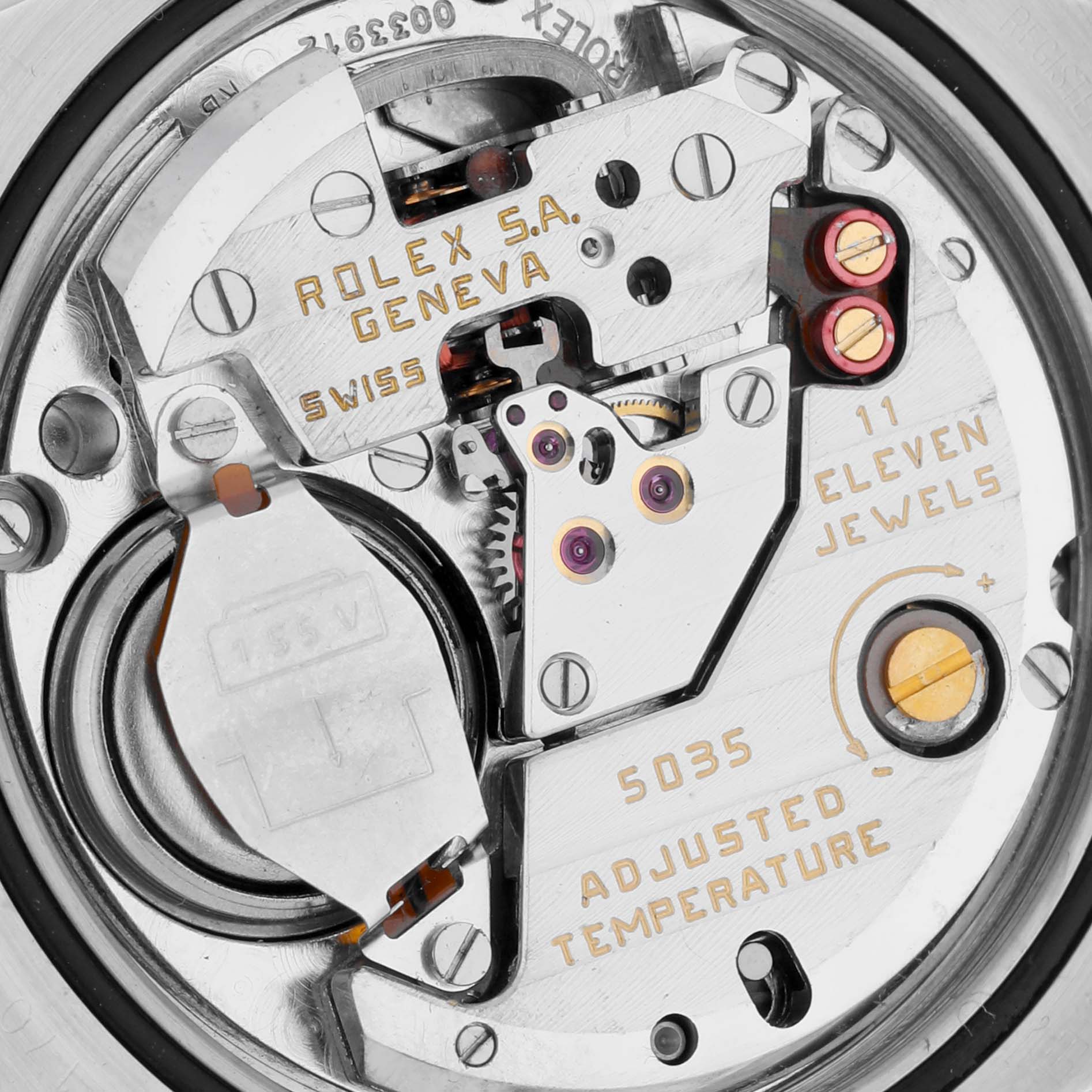 This is a close-up view of the Rolex Oysterquartz 17013 Men's Steel and Gold (two tone) Silver Dial 17013 Men's Steel and Gold (two tone) Silver Dial movement, showcasing its intricate components and engravings.