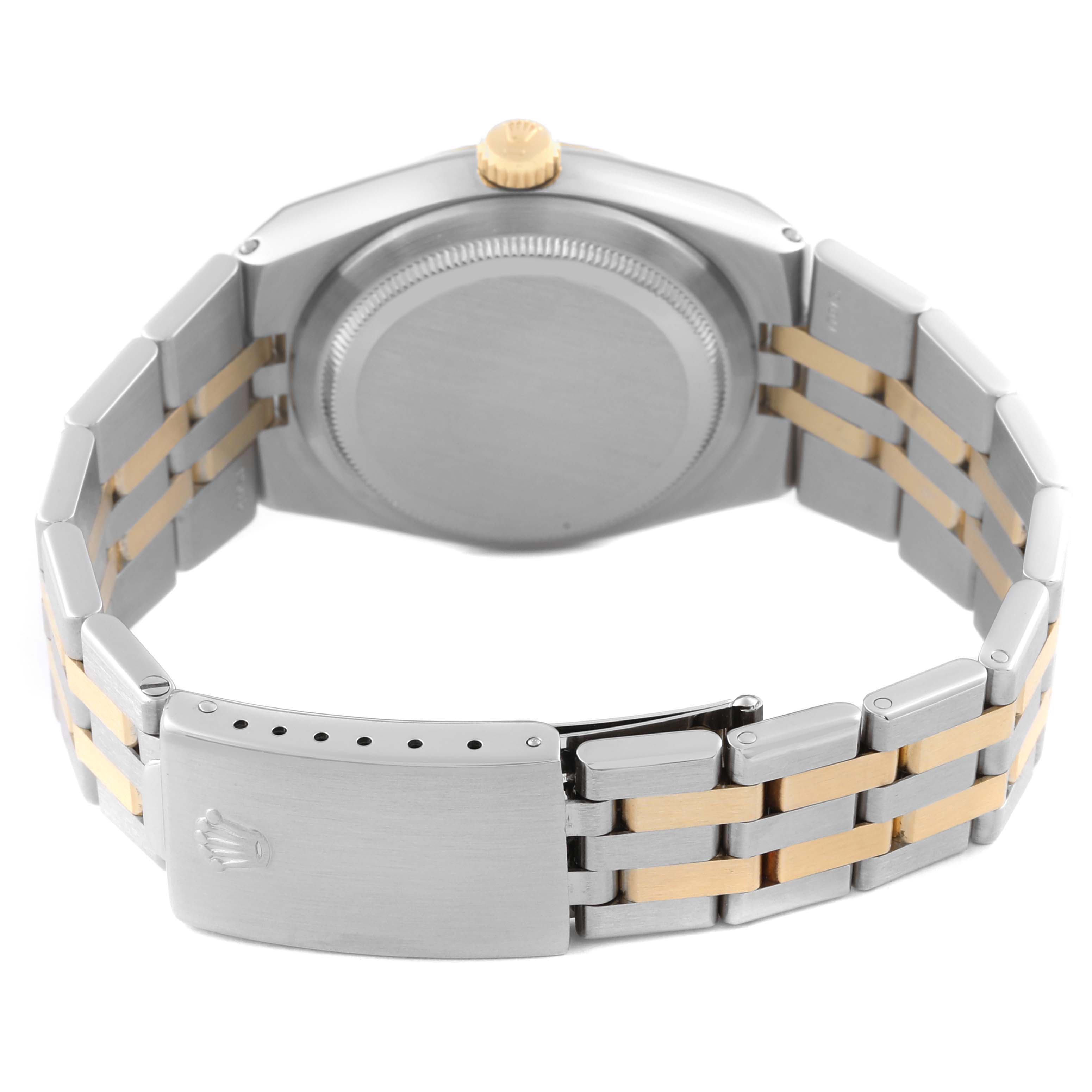 The image shows the back view of a Rolex Oysterquartz 17013 Men's Steel and Gold (two tone) Silver Dial 17013 Men's Steel and Gold (two tone) Silver Dial watch, highlighting its case back, bracelet, and clasp with the Rolex logo.