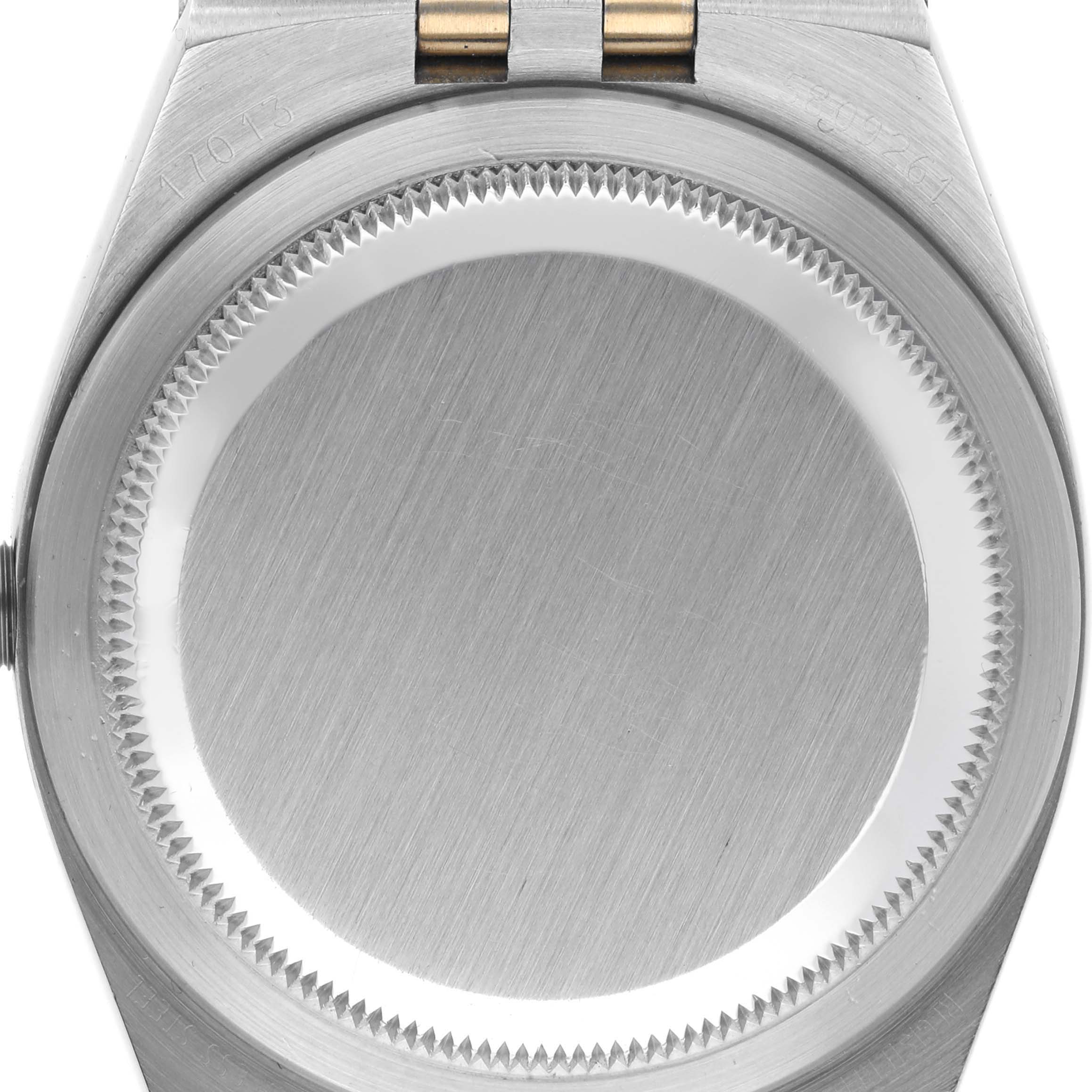 The image shows the back case of a Rolex Oysterquartz 17013 Men's Steel and Gold (two tone) Silver Dial 17013 Men's Steel and Gold (two tone) Silver Dial watch, depicting the brushed metal surface and edges.