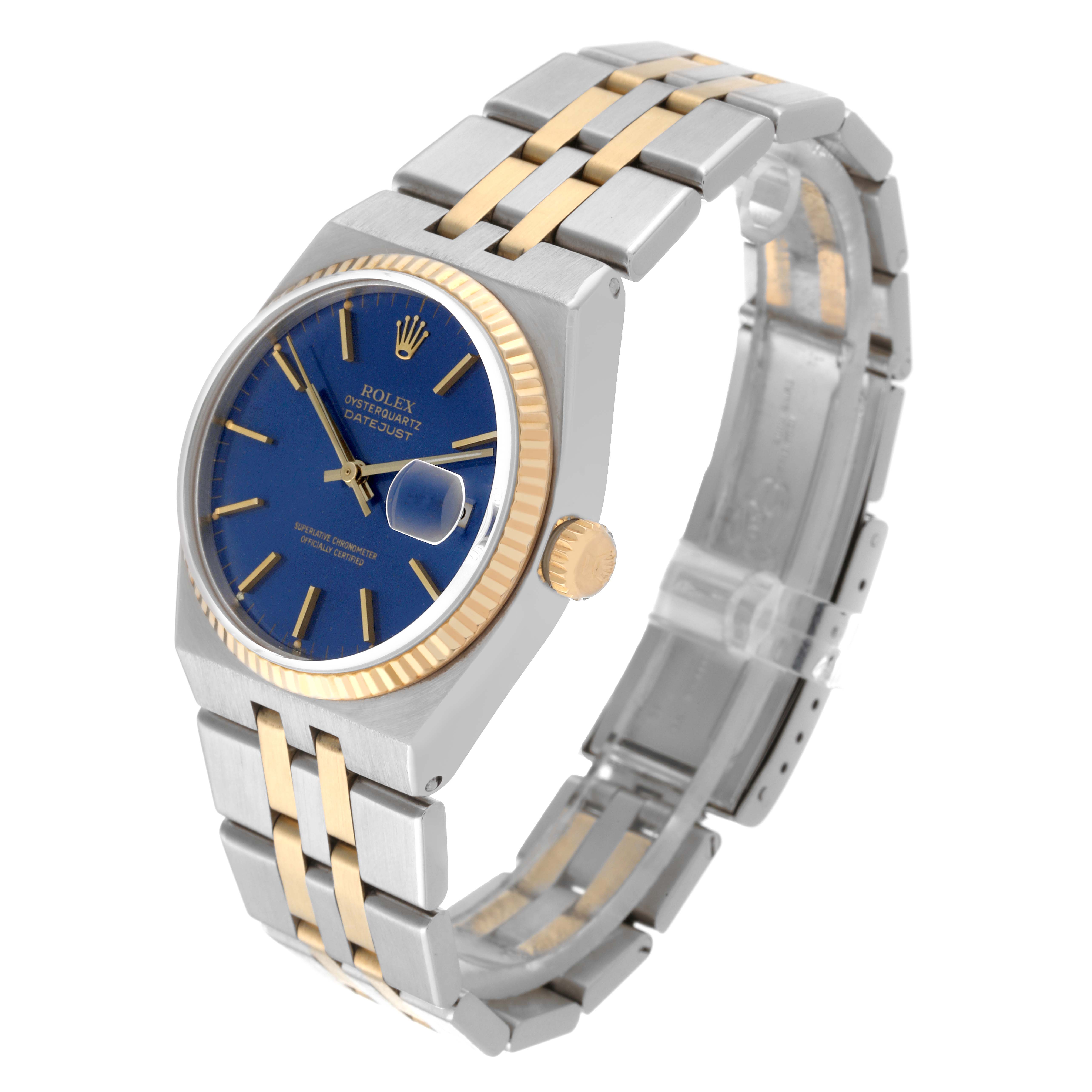 This Rolex Oysterquartz 17013 Men
s Steel and Gold (two tone) Blue Dial 17013 Men
s Steel and Gold (two tone) Blue Dial watch is shown at an oblique angle, displaying the face, bezel, crown, and part of the bracelet.