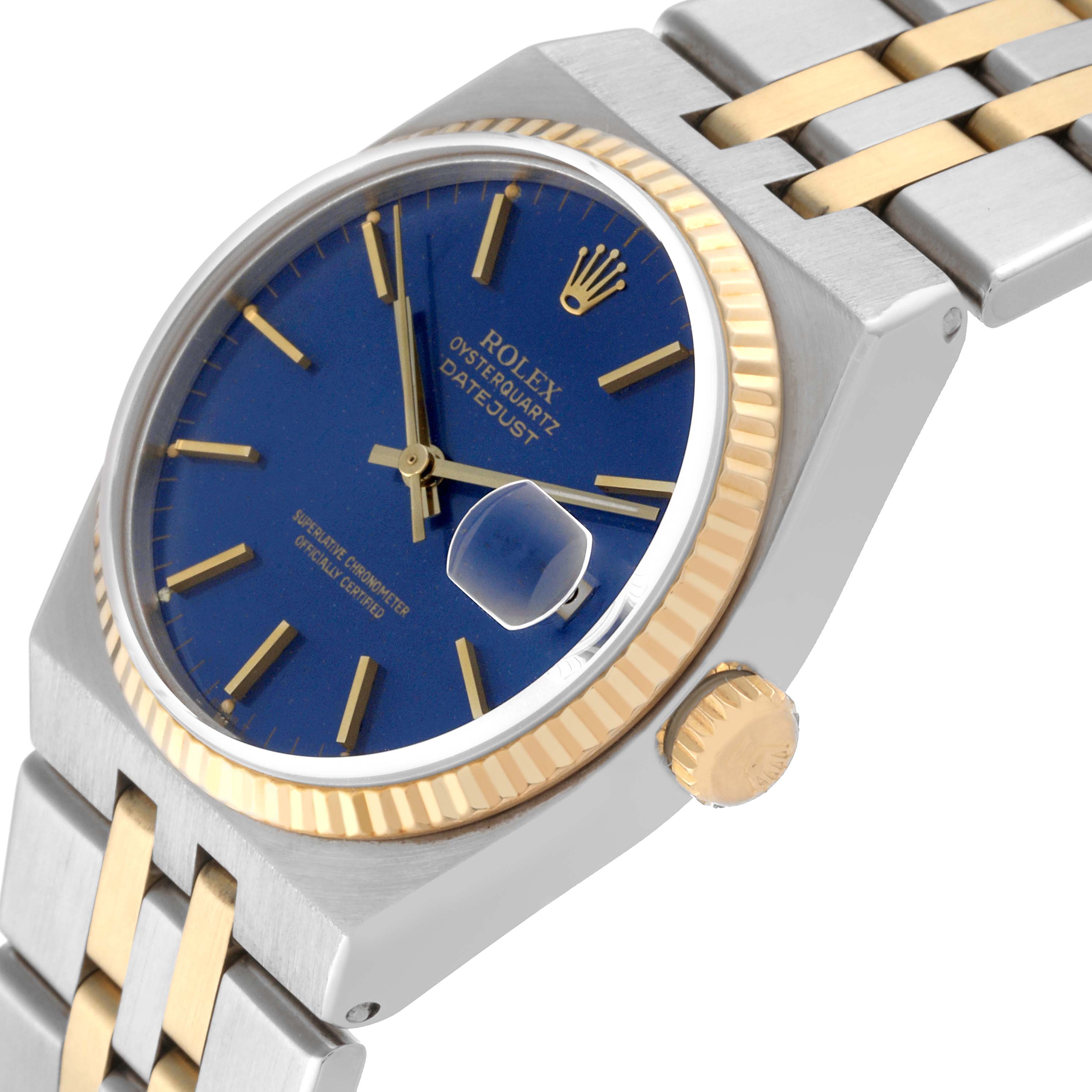 The image shows a close-up angled view of a Rolex Oysterquartz 17013 Men
s Steel and Gold (two tone) Blue Dial 17013 Men
s Steel and Gold (two tone) Blue Dial Datejust watch, highlighting the blue dial, crown, and two-tone bracelet.