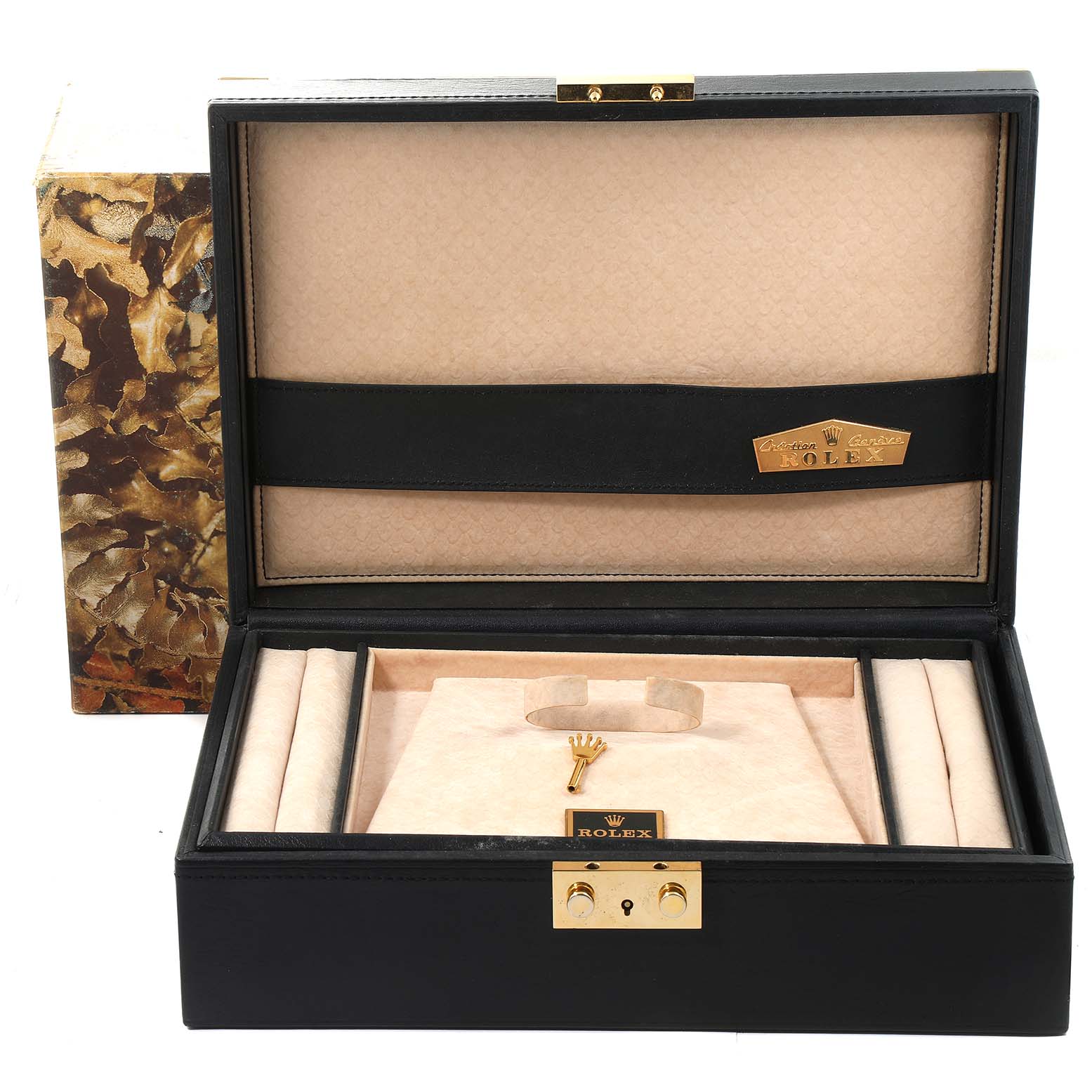 The image shows an open Rolex Pearlmaster 80299 Women's White Gold White Dial 80299 Women's White Gold White Dial watch box with no watch inside, featuring branded interior and a key.