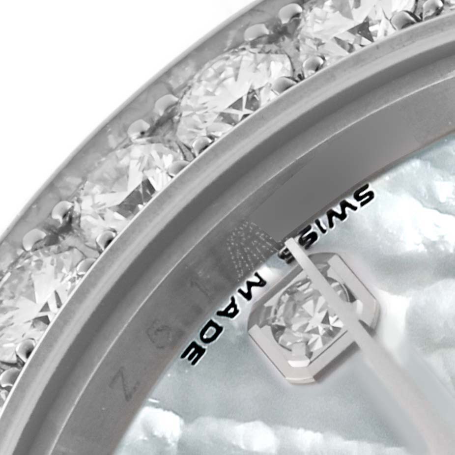 This image shows a close-up of the diamond bezel and a part of the dial, including the "Swiss Made" text, of a Rolex Pearlmaster 80299 Women's White Gold Mother of Pearl Dial 80299 Women's White Gold Mother of Pearl Dial watch.