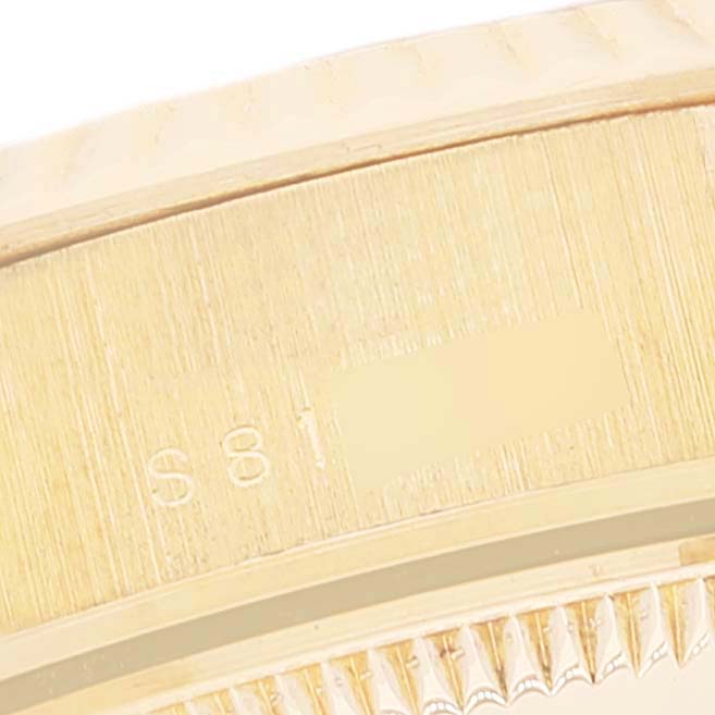 This image shows a close-up of the side and part of the bezel of a Rolex President 69178 Women's Yellow Gold Blue Dial 69178 Women's Yellow Gold Blue Dial model watch.