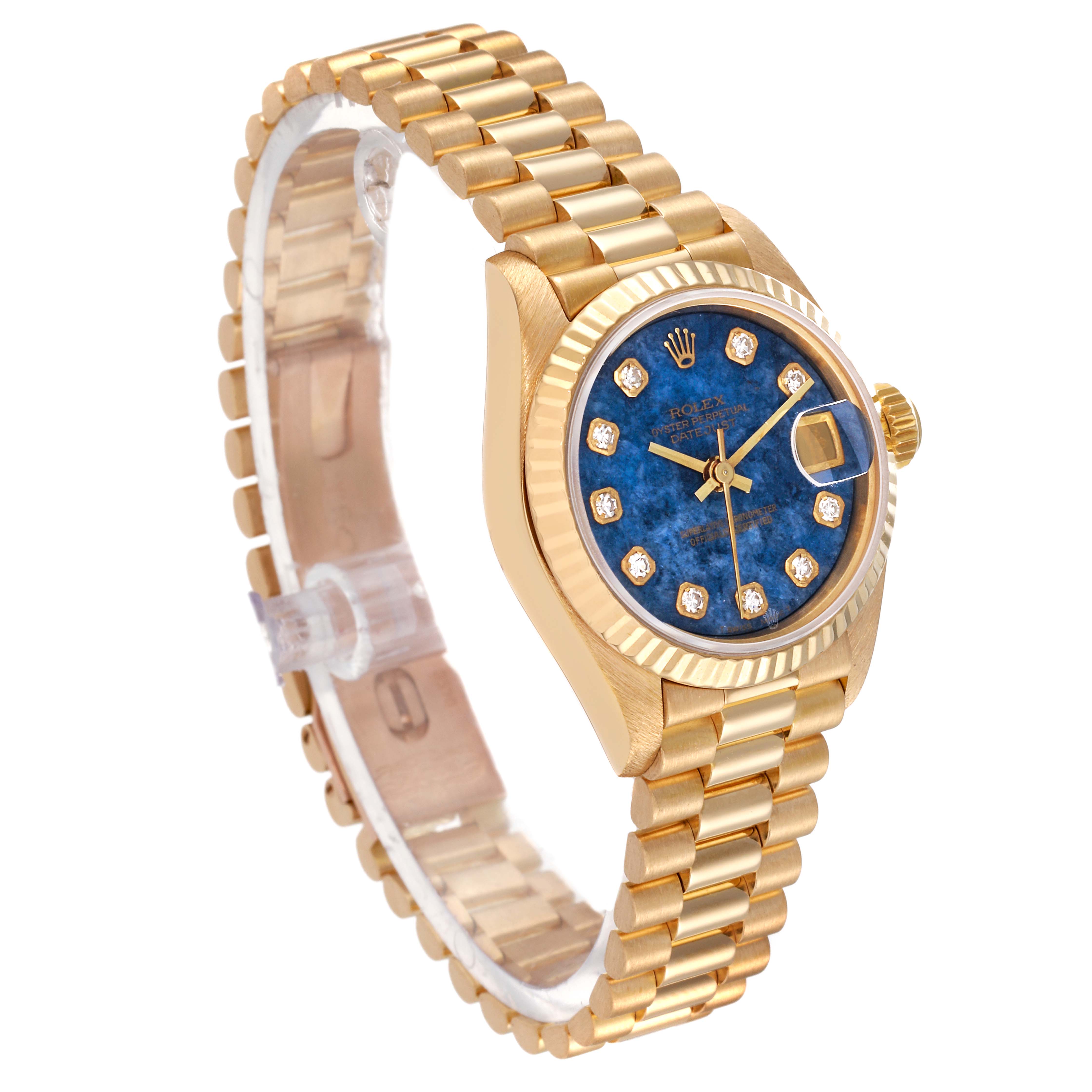 The image shows a Rolex President 69178 Women's Yellow Gold Blue Dial 69178 Women's Yellow Gold Blue Dial watch from an angle highlighting the blue dial, bezel, and gold bracelet.
