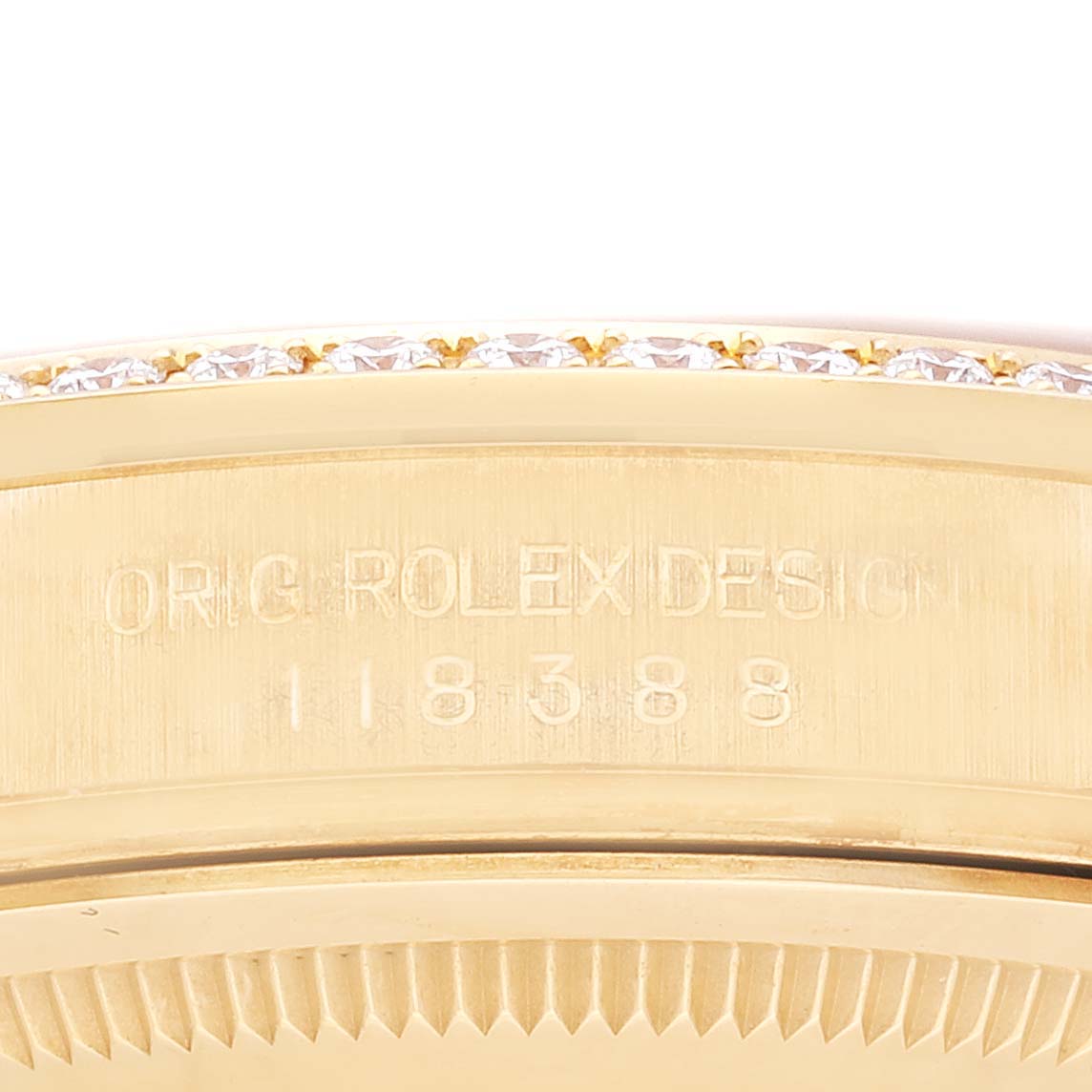 The image shows a close-up of the case side of a Rolex President 118388 Men's Yellow Gold Champagne Dial 118388 Men's Yellow Gold Champagne Dial model, revealing its design and reference number 118388.