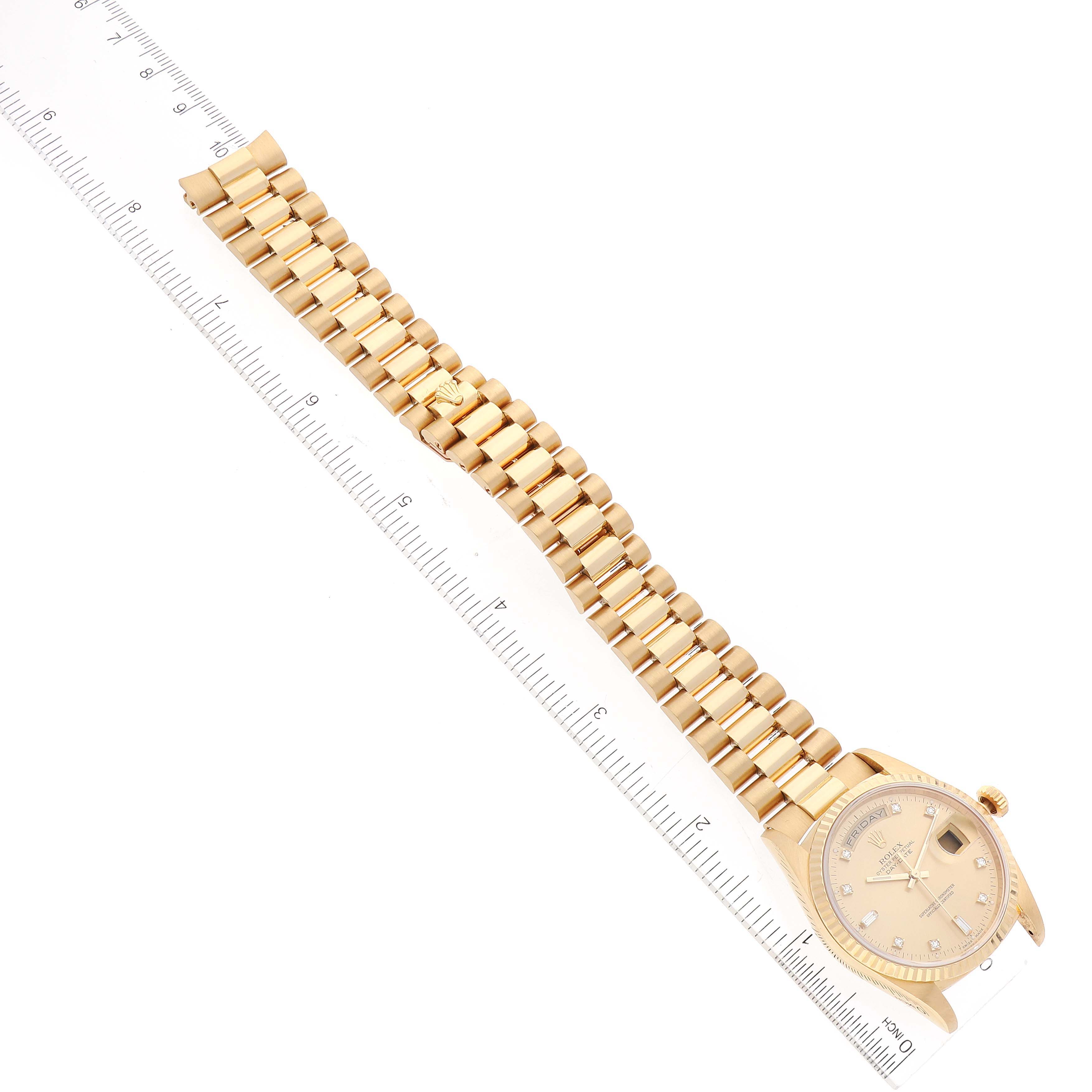 The image shows a Rolex President 18238 Men's Yellow Gold Champagne Dial 18238 Men's Yellow Gold Champagne Dial model watch, displayed flat alongside a ruler to measure its band length.