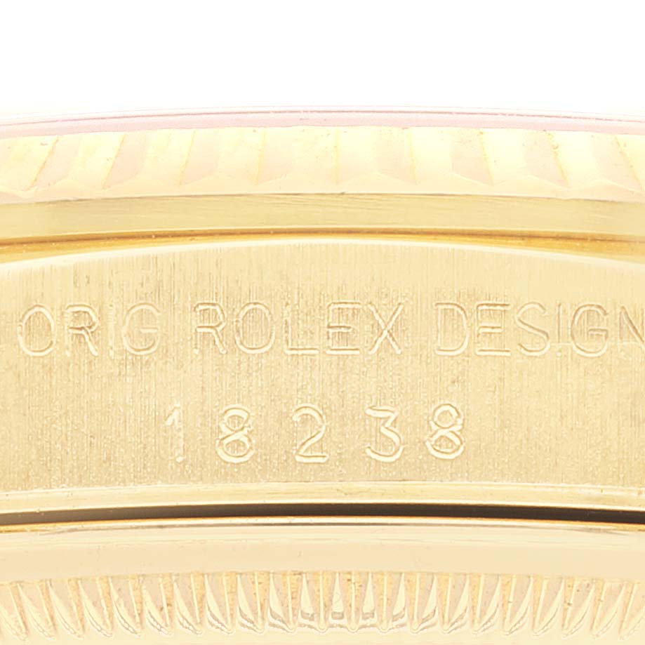 Close-up view of the serial number and engraving on the side of a Rolex President 18238 Men's Yellow Gold Champagne Dial 18238 Men's Yellow Gold Champagne Dial model.