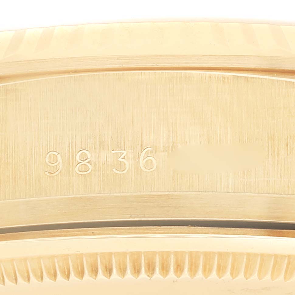 This close-up shows the serial number engraved on the side of the case of the Rolex President 18038 Men's Yellow Gold Silver Dial 18038 Men's Yellow Gold Silver Dial model watch.