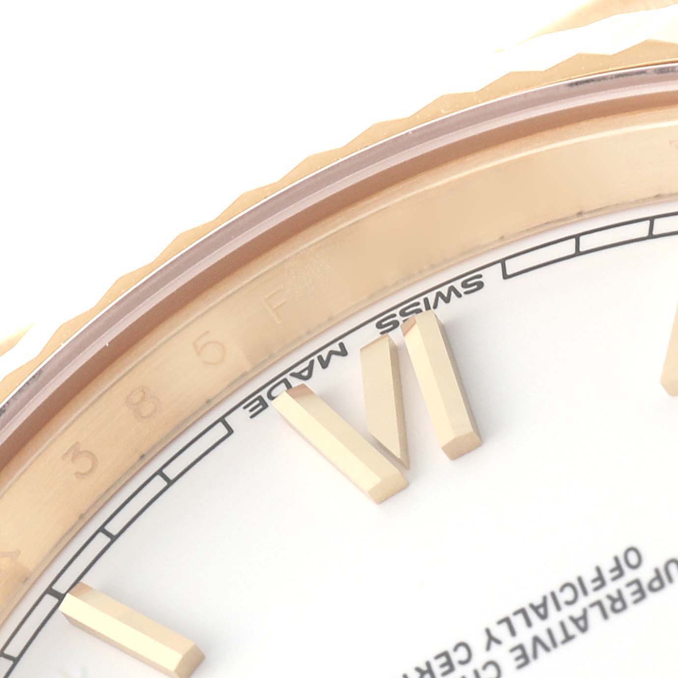 This close-up photograph of the Rolex President 228238 Men
s Yellow Gold White Dial 228238 Men
s Yellow Gold White Dial model shows the watch face, including the bezel, Roman numeral markers, and part of the chapter ring.