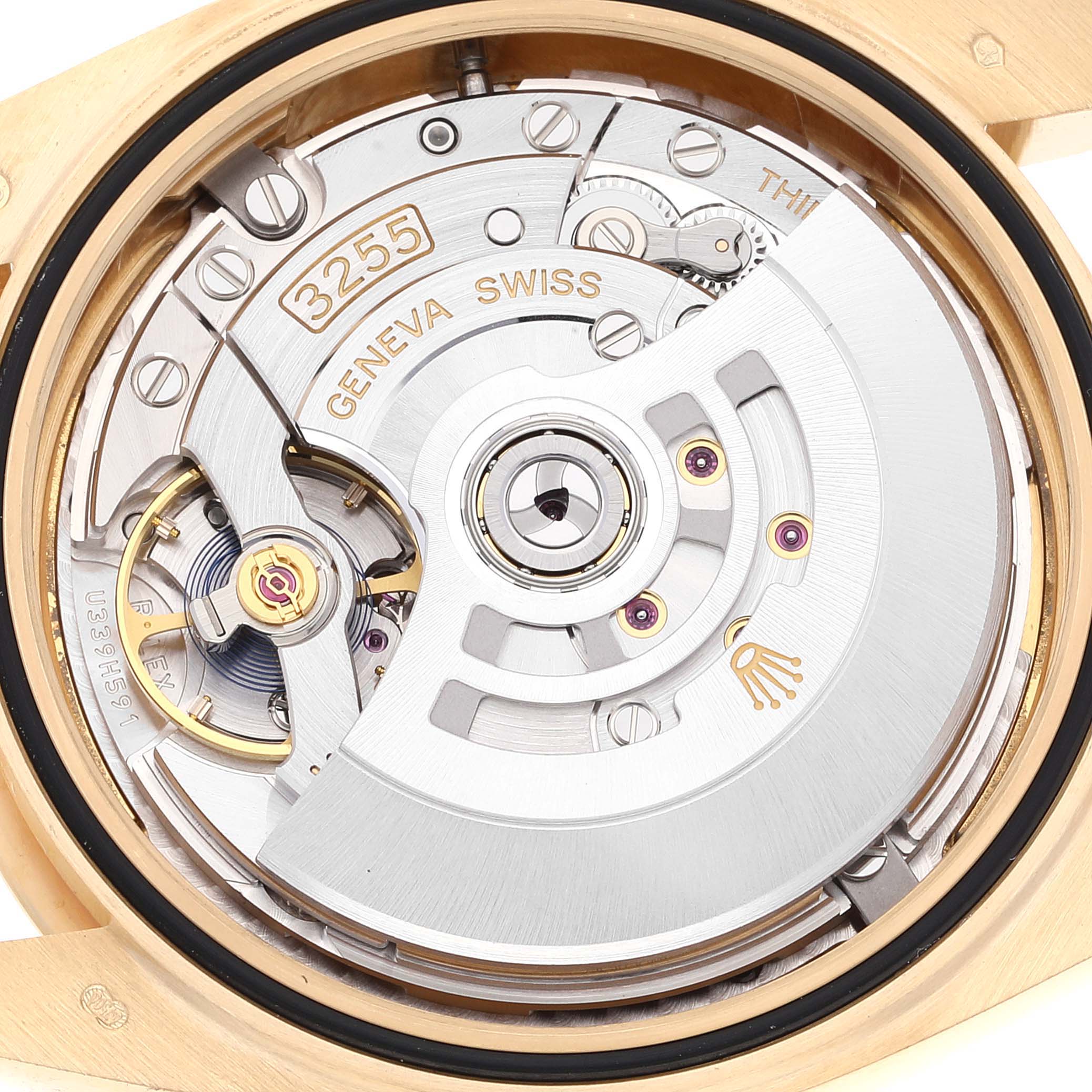 This is a close-up view showing the intricate internal mechanism of a Rolex President 228238 Men
s Yellow Gold White Dial 228238 Men
s Yellow Gold White Dial model watch.