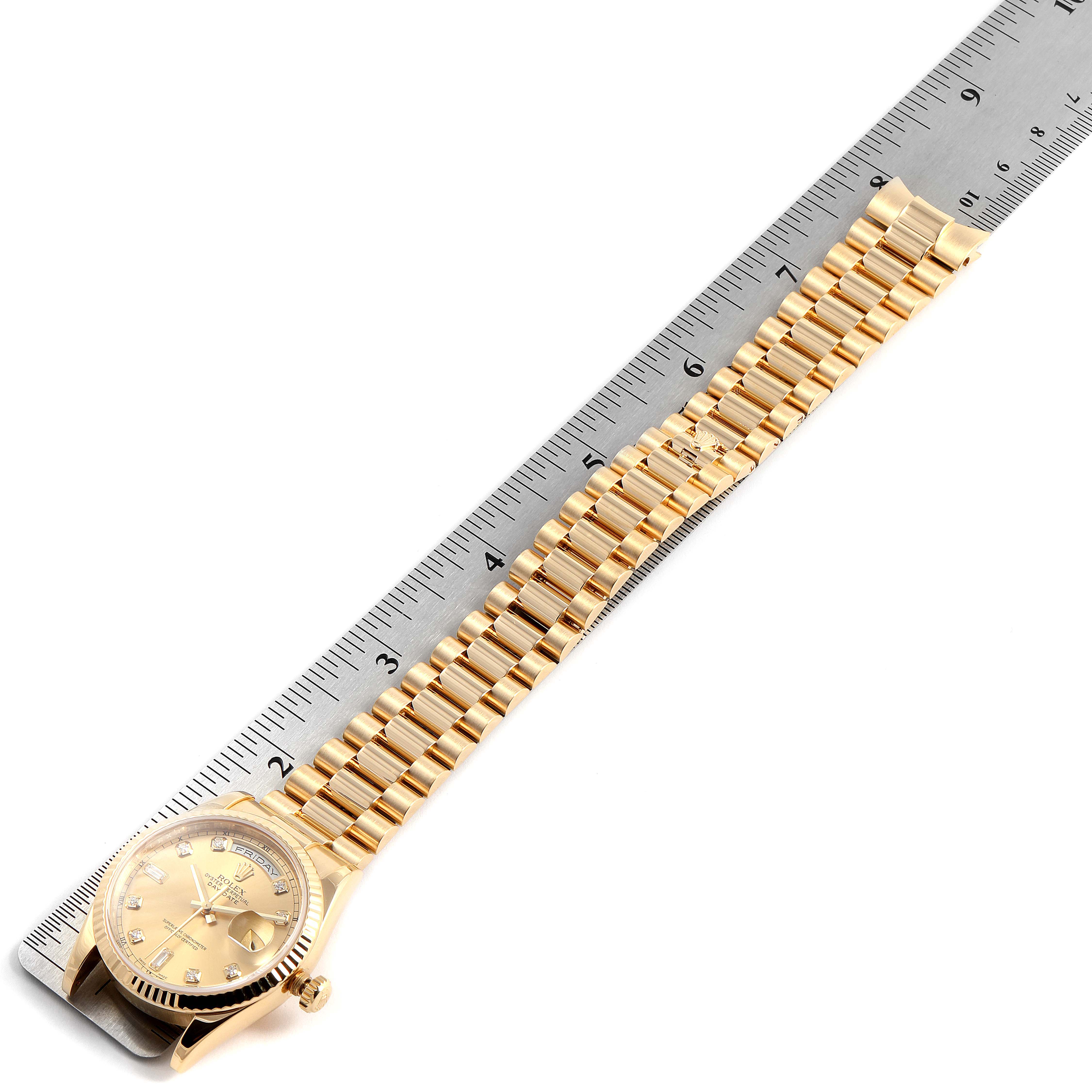 This image shows a top-down view of the Rolex President 118238 Men's Yellow Gold Champagne Dial 118238 Men's Yellow Gold Champagne Dial watch, displaying its full gold bracelet and face alongside a ruler for scale.