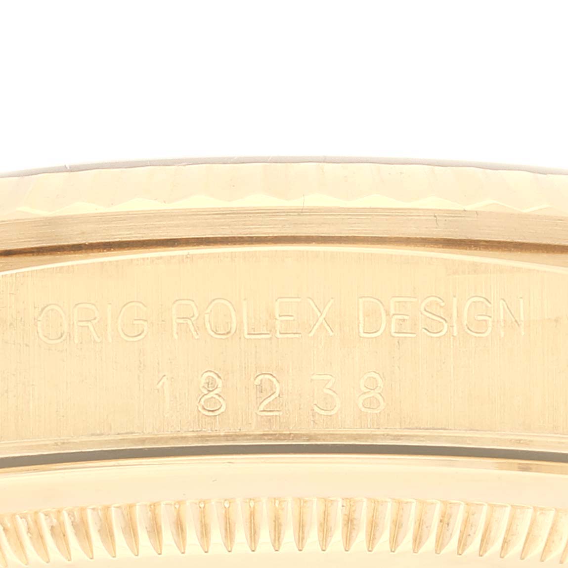 This image shows the engraved side of the case for the Rolex President 18238 Men's Yellow Gold Champagne Dial 18238 Men's Yellow Gold Champagne Dial model, featuring the model number 18238.