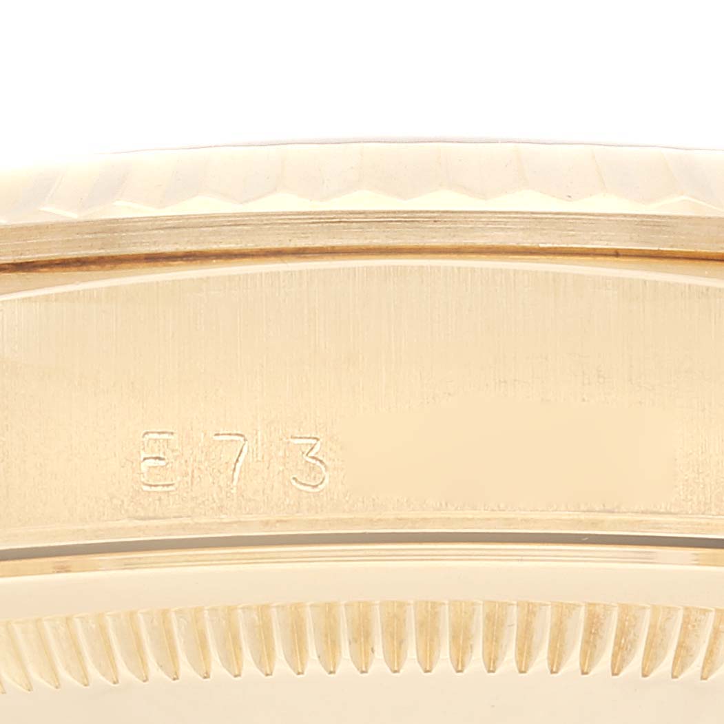 The image shows a close-up angle of the bezel and engraving detail of a Rolex President 18238 Men's Yellow Gold Champagne Dial 18238 Men's Yellow Gold Champagne Dial model watch.