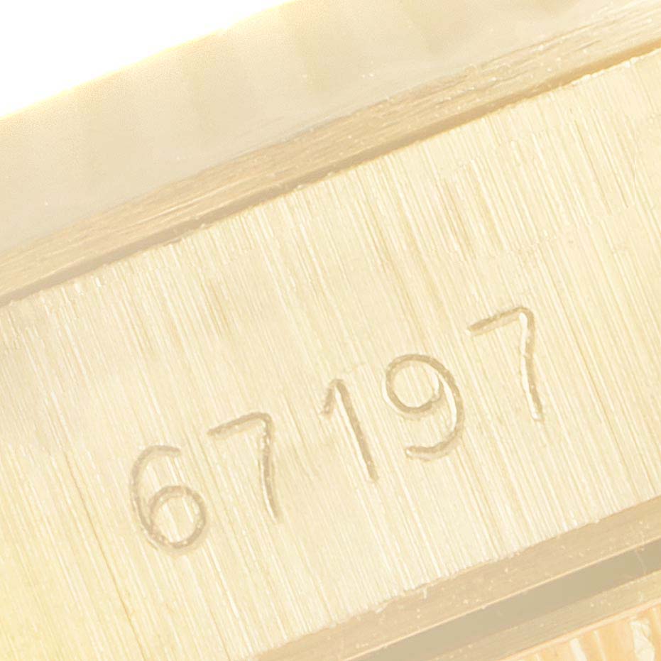 This is a close-up of the serial number engraving on the Rolex President 67198 Women's Yellow Gold Champagne Dial 67198 Women's Yellow Gold Champagne Dial model watch.