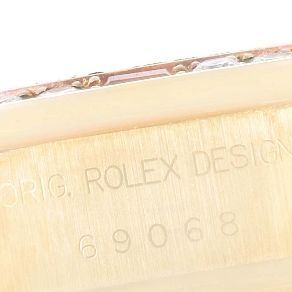 The image shows a close-up of the case side of a Rolex President 69068 Women
s Yellow Gold Champagne Dial 69068 Women
s Yellow Gold Champagne Dial model, displaying the serial number and "ORIG. ROLEX DESIGN" engraving.