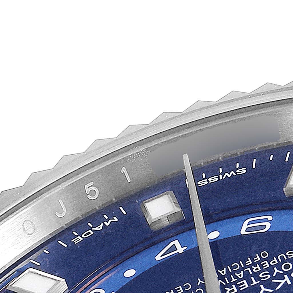 The image shows a close-up of the Rolex Sky-Dweller 326934 Men's Stainless Steel Blue Dial 326934 Men's Stainless Steel Blue Dial watch dial, including the indices, a portion of the bezel, and the minute hand.