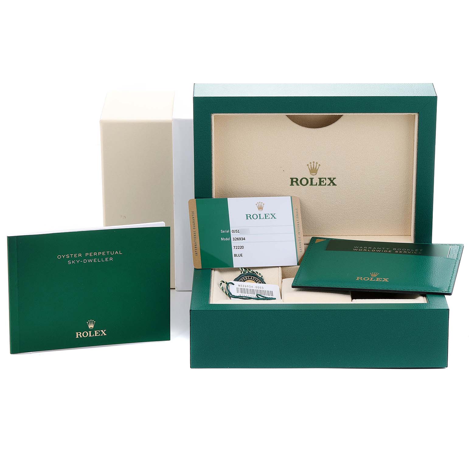 The image shows the packaging, warranty card, manuals, and accessories for the Rolex Sky-Dweller 326934 Men's Stainless Steel Blue Dial 326934 Men's Stainless Steel Blue Dial watch.