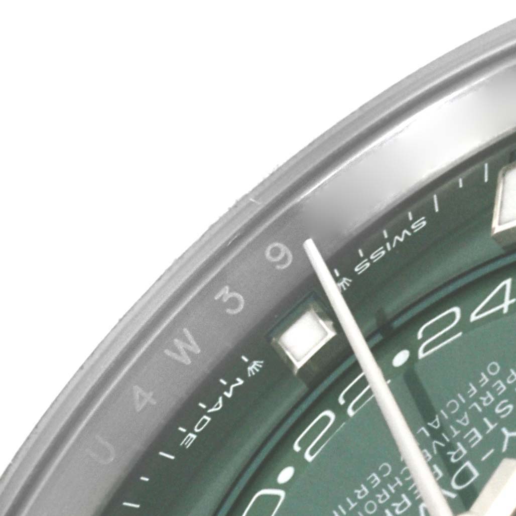 A close-up of the Rolex Sky-Dweller 336934 Men
s Stainless Steel Green Dial 336934 Men
s Stainless Steel Green Dial watch displays the dial from 4 to 9, part of the 24-hour ring, and a hand indicator.