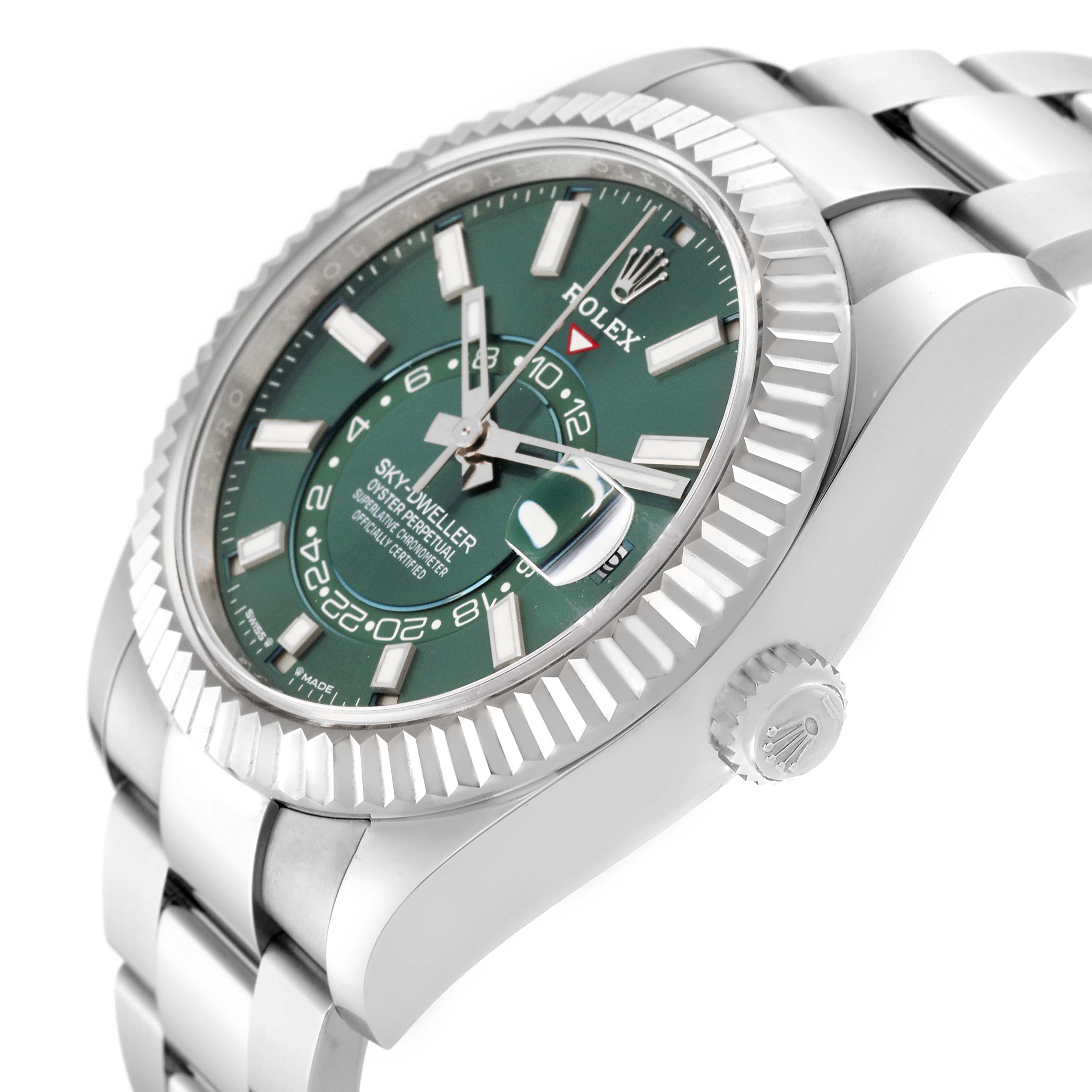 The image shows a side angle view of the Rolex Sky-Dweller 336934 Men
s Stainless Steel Green Dial 336934 Men
s Stainless Steel Green Dial watch, featuring the green dial, fluted bezel, and part of the bracelet.