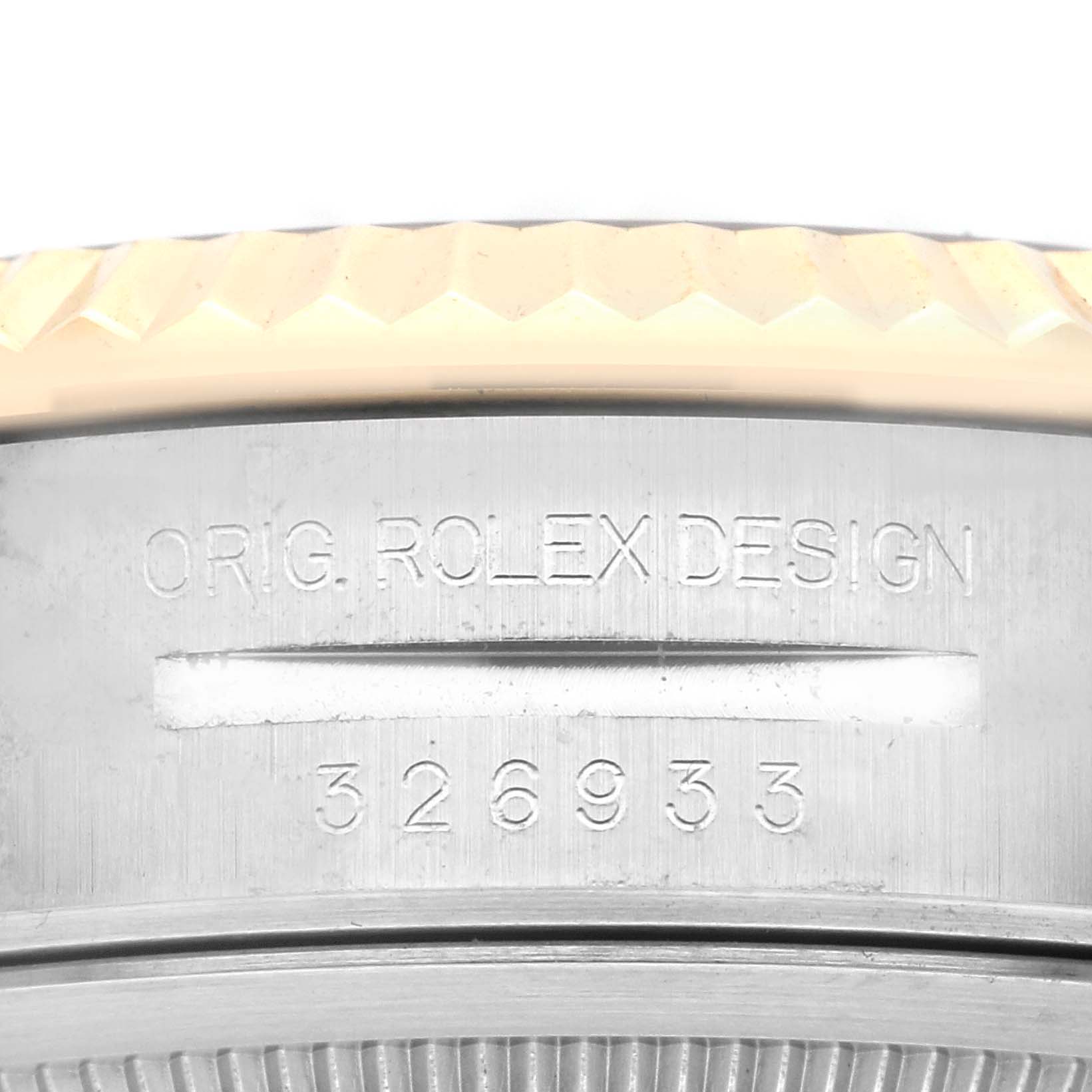 The image shows a close-up of the engraved casing on a Rolex Sky-Dweller 326933 Men
s Steel and Gold (two tone) Black Dial 326933 Men
s Steel and Gold (two tone) Black Dial watch, displaying the model number and "ORIG. ROLEX DESIGN".
