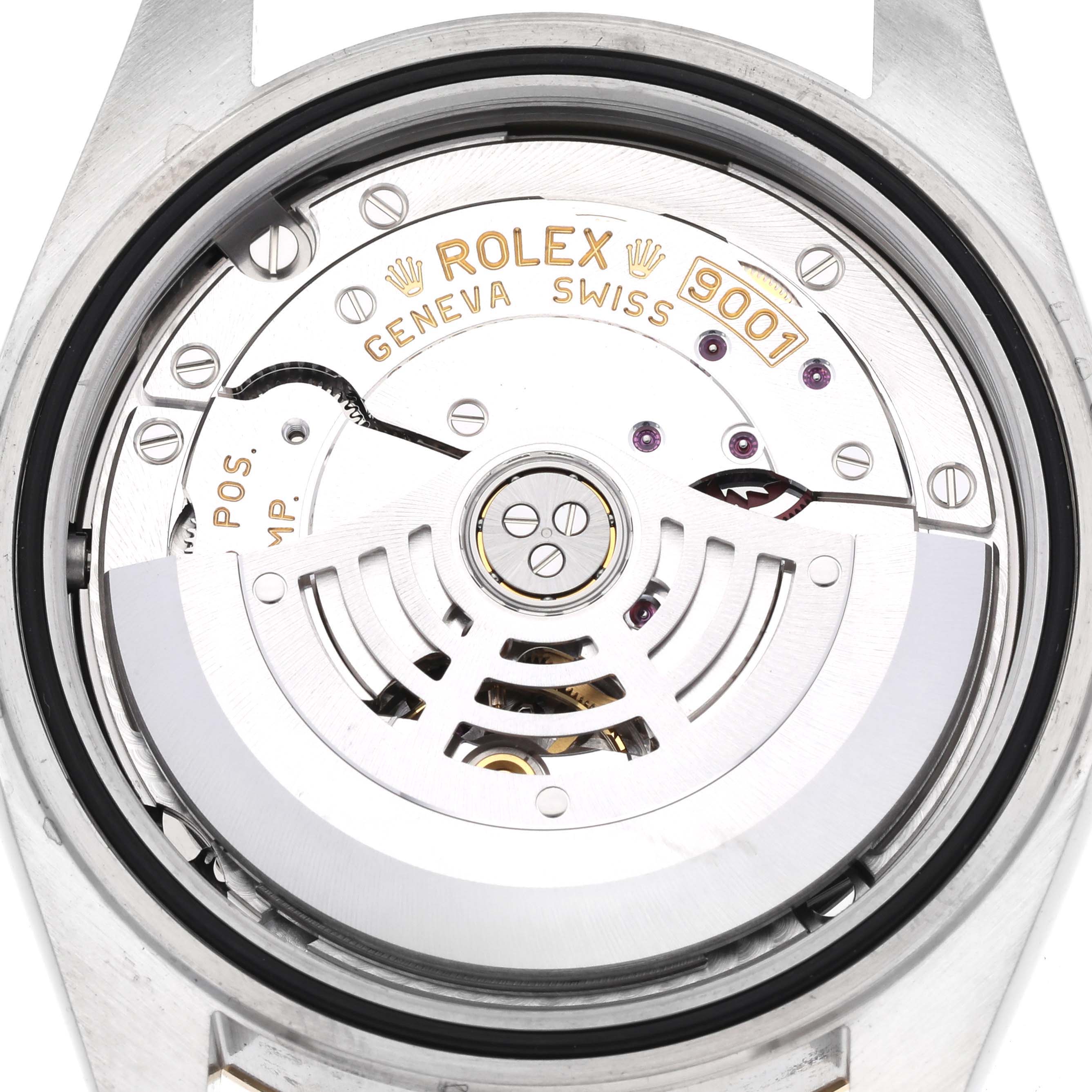 The image shows the back view of a Rolex Sky-Dweller 326933 Men
s Steel and Gold (two tone) Black Dial 326933 Men
s Steel and Gold (two tone) Black Dial watch, highlighting its internal movement and components.