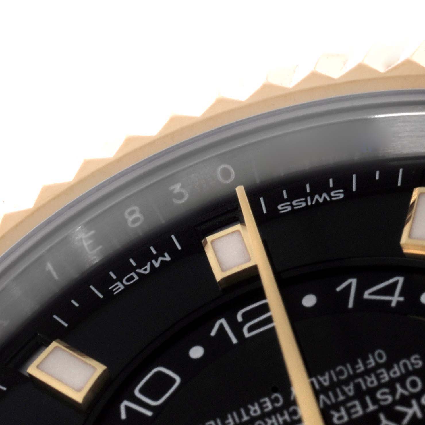 This close-up angle of the Rolex Sky-Dweller 326933 Men
s Steel and Gold (two tone) Black Dial 326933 Men
s Steel and Gold (two tone) Black Dial watch shows part of the dial, bezel, and hour markers.