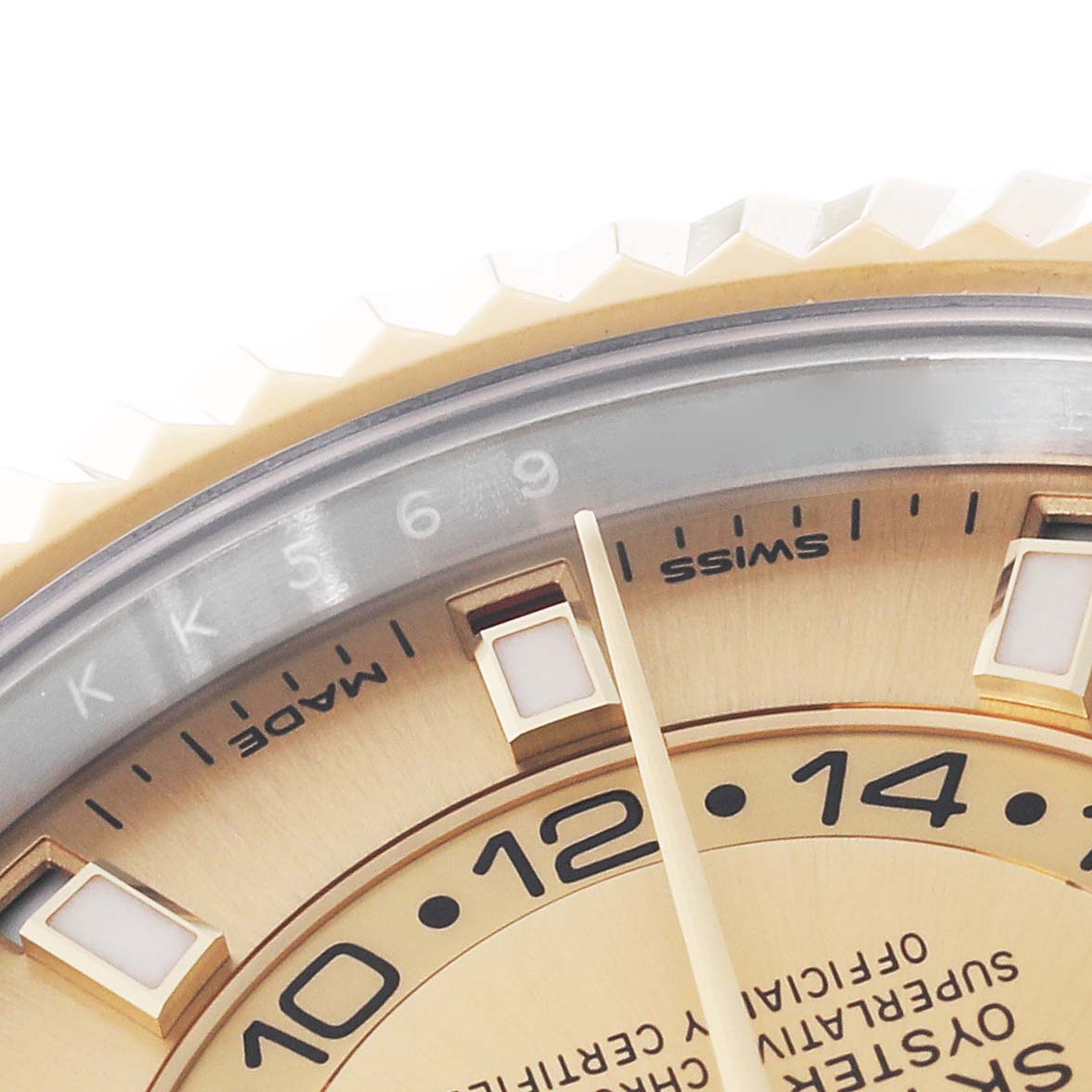 This image shows a close-up of the dial and a portion of the bezel of the Rolex Sky-Dweller 326933 Men's Steel and Gold (two tone) Champagne Dial 326933 Men's Steel and Gold (two tone) Champagne Dial watch, highlighting its hour markers and detailing.