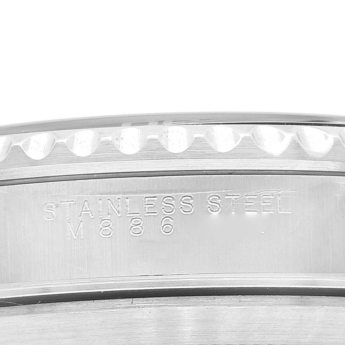 The image shows a close-up of the stainless steel case back with markings on a Rolex Submariner 14060M Men
s Stainless Steel Black Dial 14060M Men
s Stainless Steel Black Dial watch.