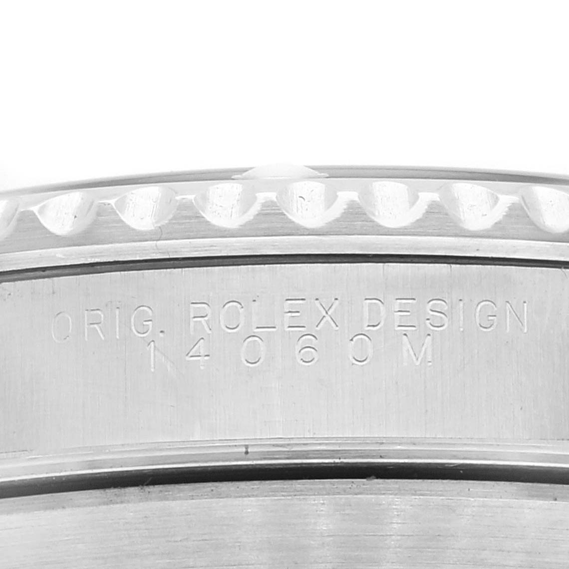 This image shows a close-up of the side of a Rolex Submariner 14060M Men
s Stainless Steel Black Dial 14060M Men
s Stainless Steel Black Dial, highlighting the engraved "ORIG. ROLEX DESIGN 14060M".
