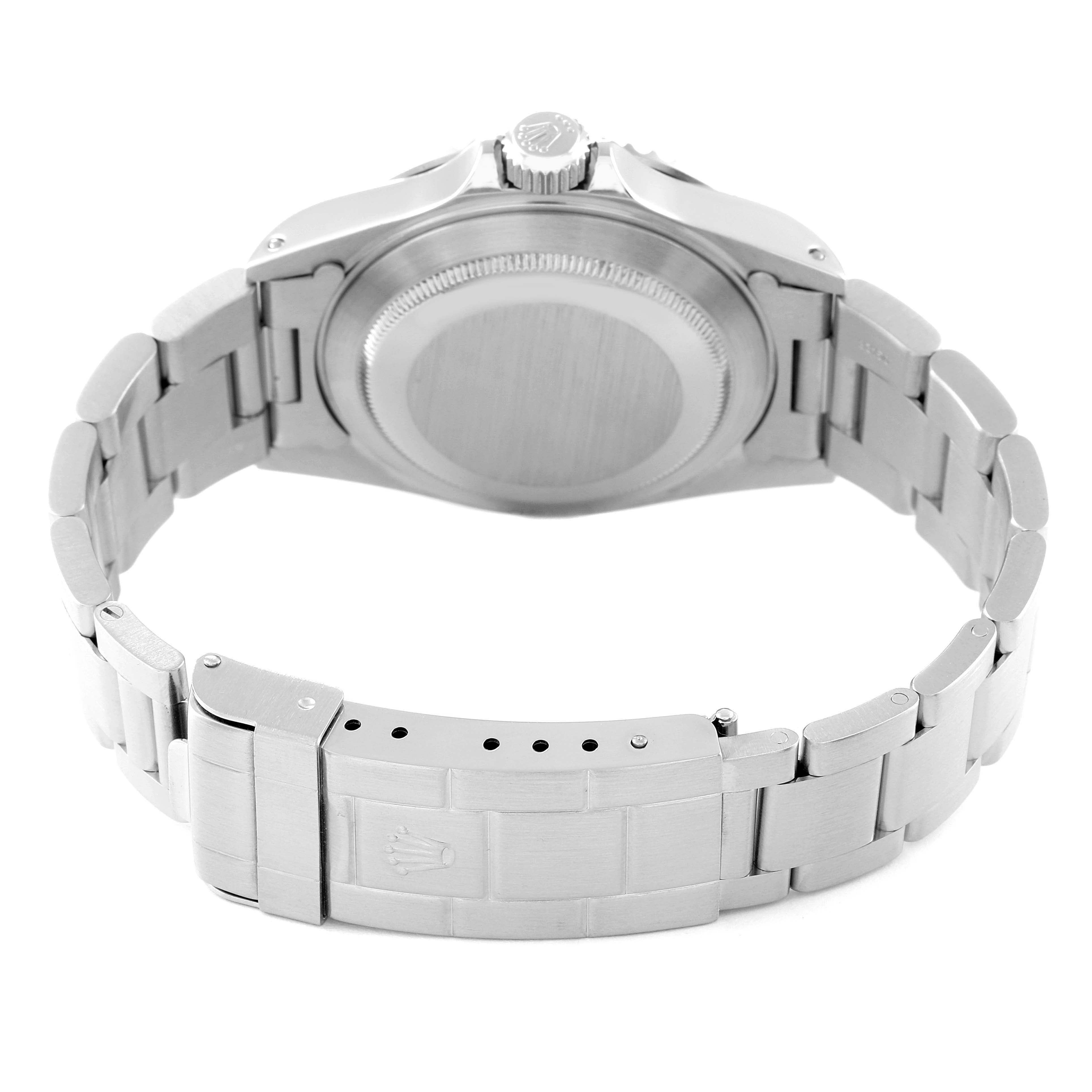 This image shows the back case and stainless steel bracelet of a Rolex Submariner 14060M Men
s Stainless Steel Black Dial 14060M Men
s Stainless Steel Black Dial watch from a rear angle.