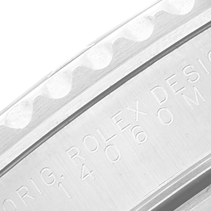 The image shows a close-up view of the bezel and engraved text on the side casing of a Rolex Submariner 14060M Men
s Stainless Steel Black Dial 14060M Men
s Stainless Steel Black Dial watch.