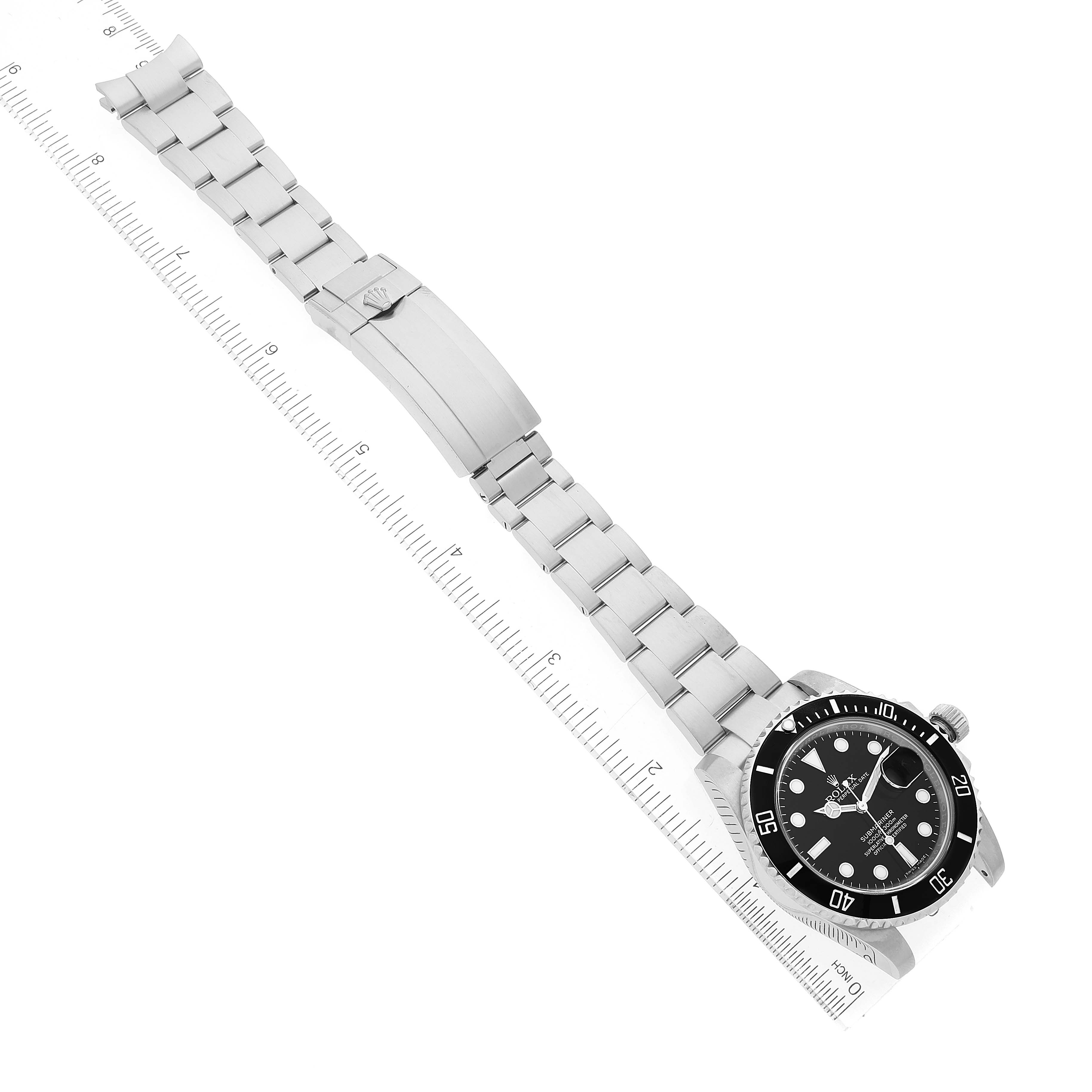 The image shows a top view of a Rolex Submariner 116610 Men
s Stainless Steel Black Dial 116610 Men
s Stainless Steel Black Dial watch, including the full stainless steel bracelet and partially visible face.