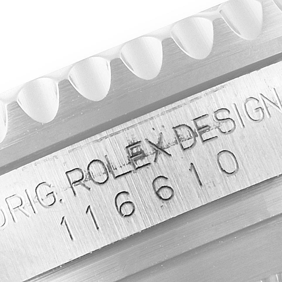 This close-up image shows the engraved model number and "ROLEX DESIGN" on the side of a Submariner watch by Rolex.