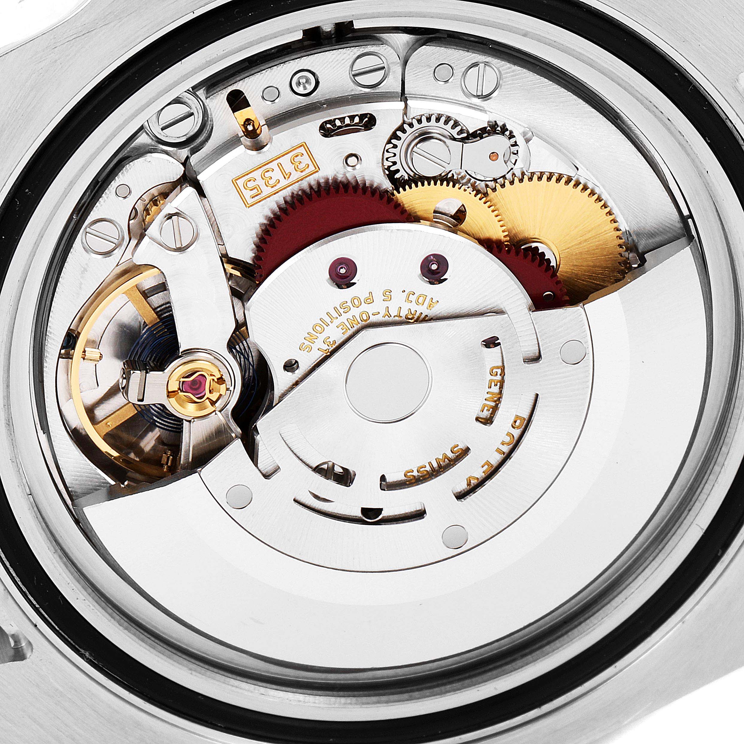 This image shows a close-up view of the movement mechanism inside a Rolex Submariner 116610LV Men
s Stainless Steel Green Dial 116610LV Men
s Stainless Steel Green Dial watch.