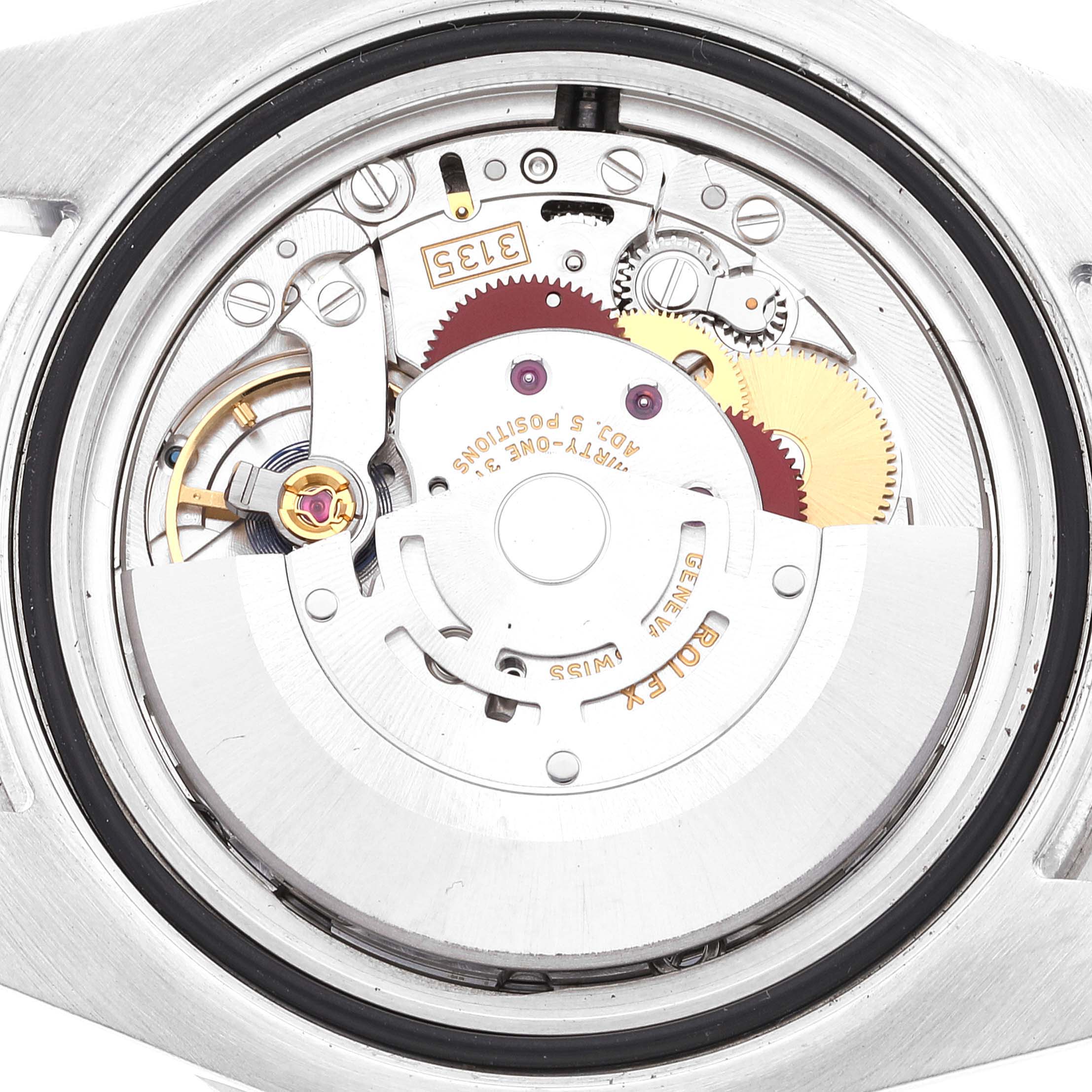 This is an interior view of the Rolex Submariner 116610LV Men
s Stainless Steel Green Dial 116610LV Men
s Stainless Steel Green Dial watch, showing its intricate movement and components.