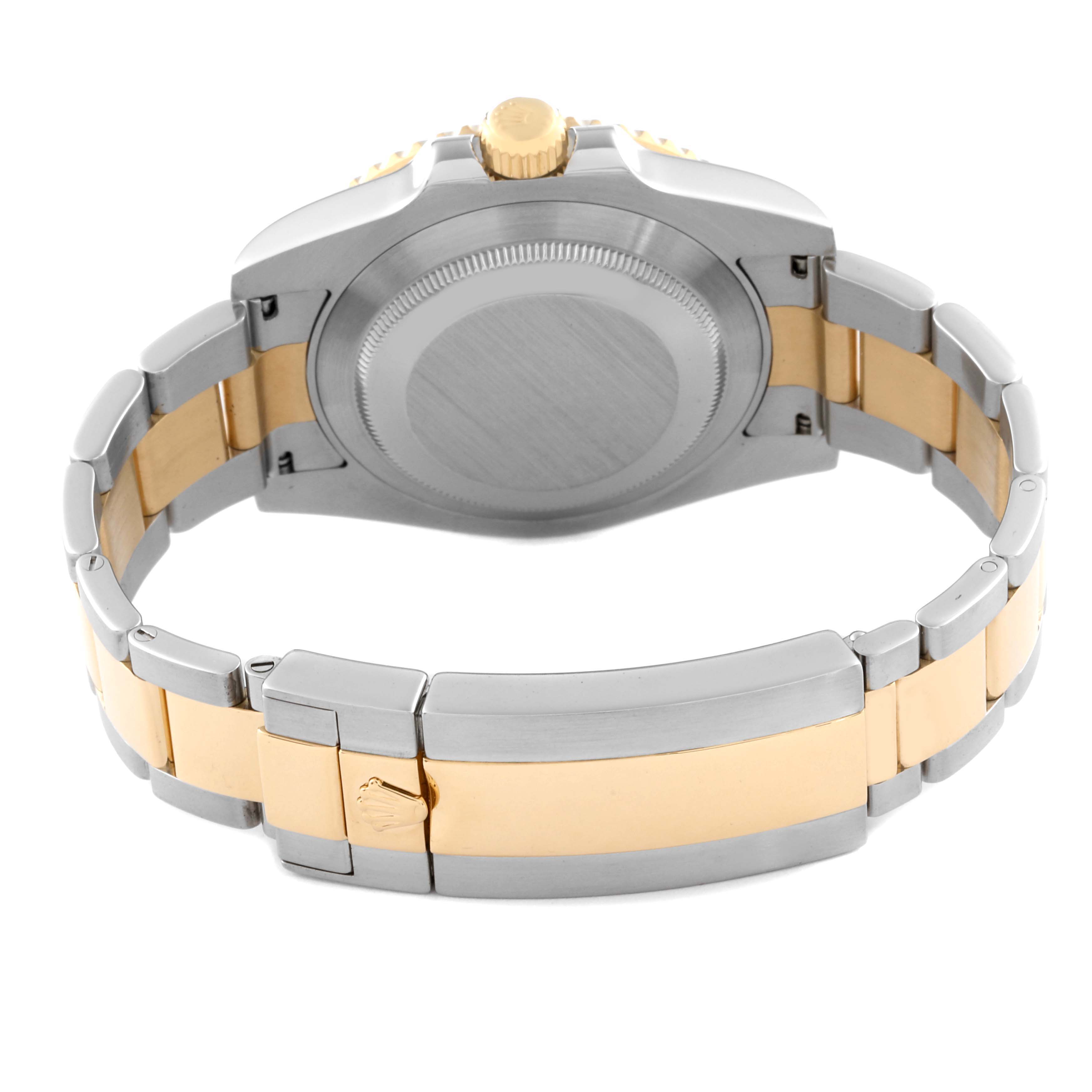 The image shows the back of the case and bracelet of a Rolex Submariner 116613 Men's Steel and Gold (two tone) Blue Dial 116613 Men's Steel and Gold (two tone) Blue Dial watch, with a focus on the clasp and crown.
