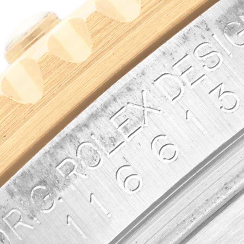 The image shows a close-up of the bezel and case side of a Rolex Submariner 116613 Men's Steel and Gold (two tone) Blue Dial 116613 Men's Steel and Gold (two tone) Blue Dial watch.