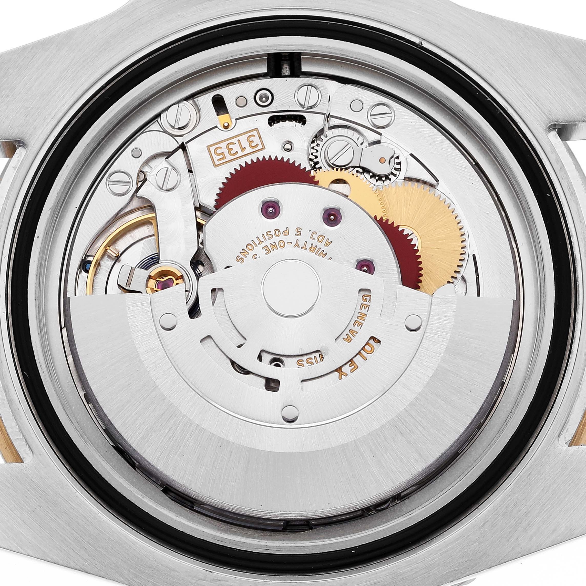 This image shows the backside view of the Rolex Submariner 116613 Men's Steel and Gold (two tone) Blue Dial 116613 Men's Steel and Gold (two tone) Blue Dial, revealing its intricate inner mechanical components.