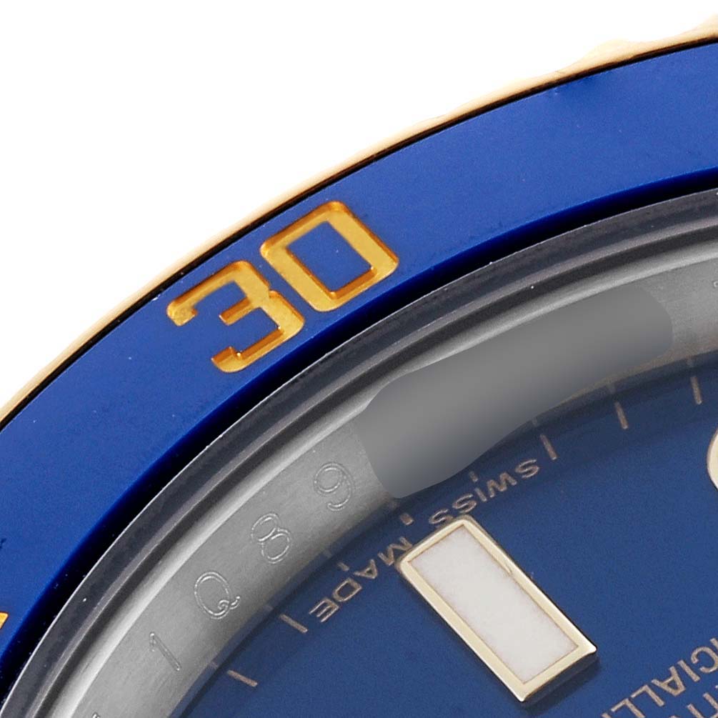 The image shows a close-up of the bezel and part of the dial of a Rolex Submariner 116613 Men's Steel and Gold (two tone) Blue Dial 116613 Men's Steel and Gold (two tone) Blue Dial watch.
